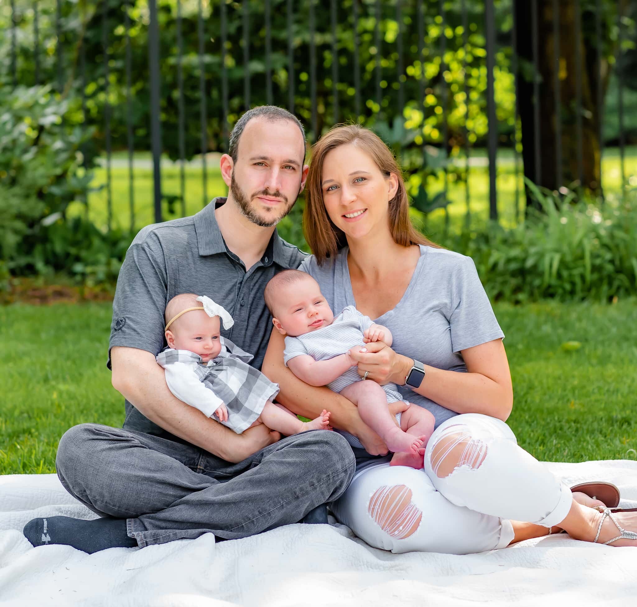 Bethesda Maryland Newborn Photoshoot - mom and dad cradling twins