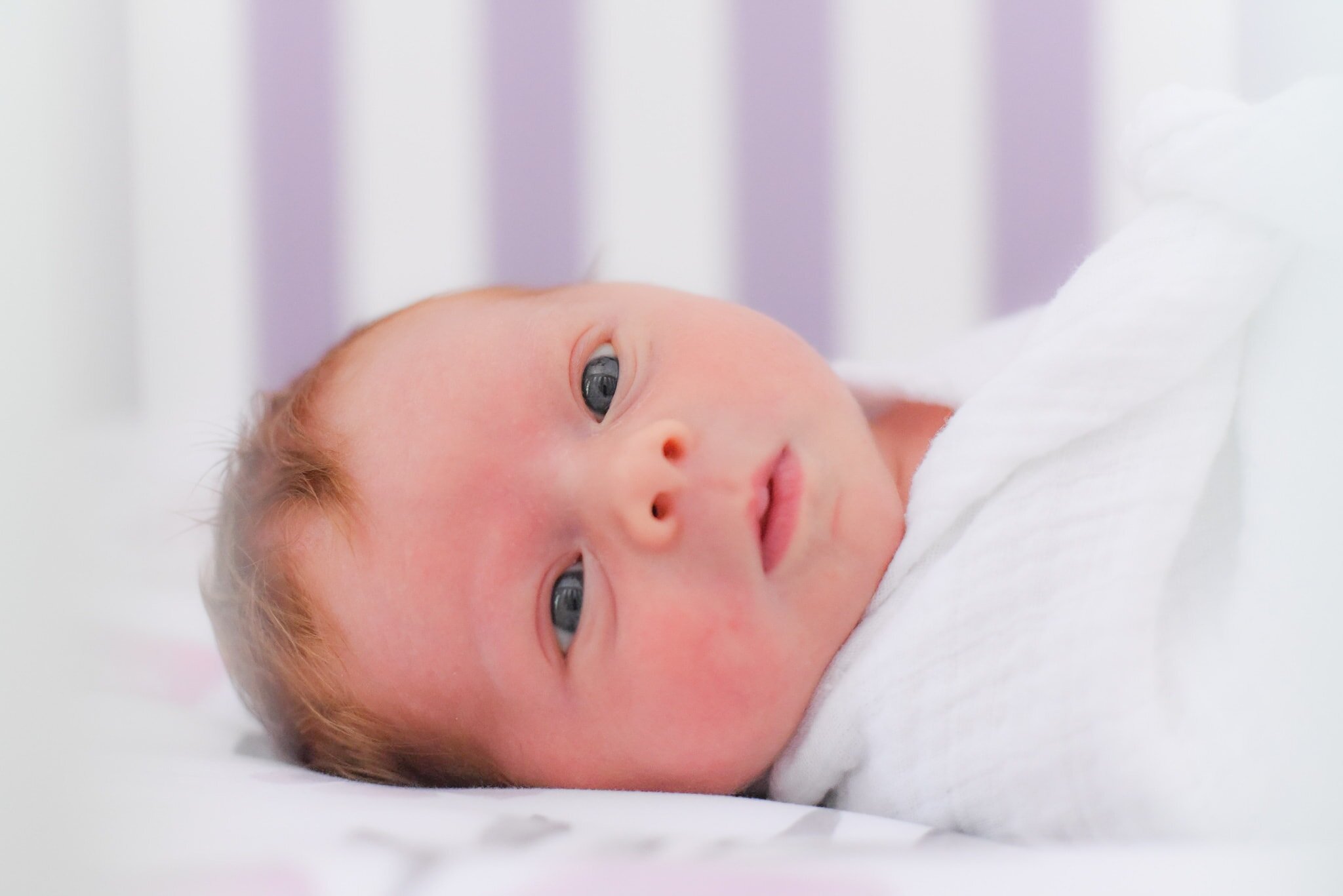 Maryland Newborn Photographer - photo of baby through crib slats