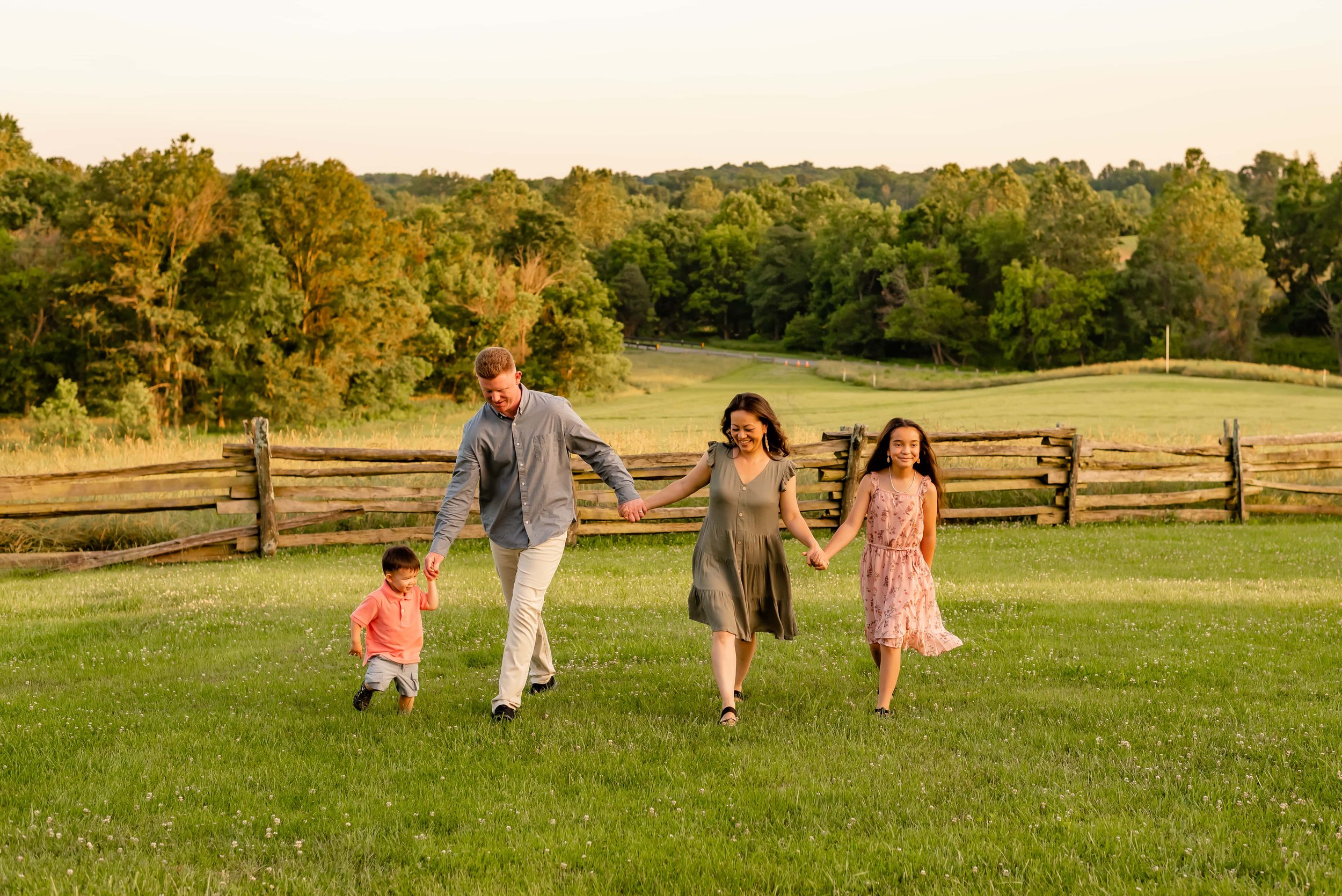 Maryland family portrait of family walking in a field