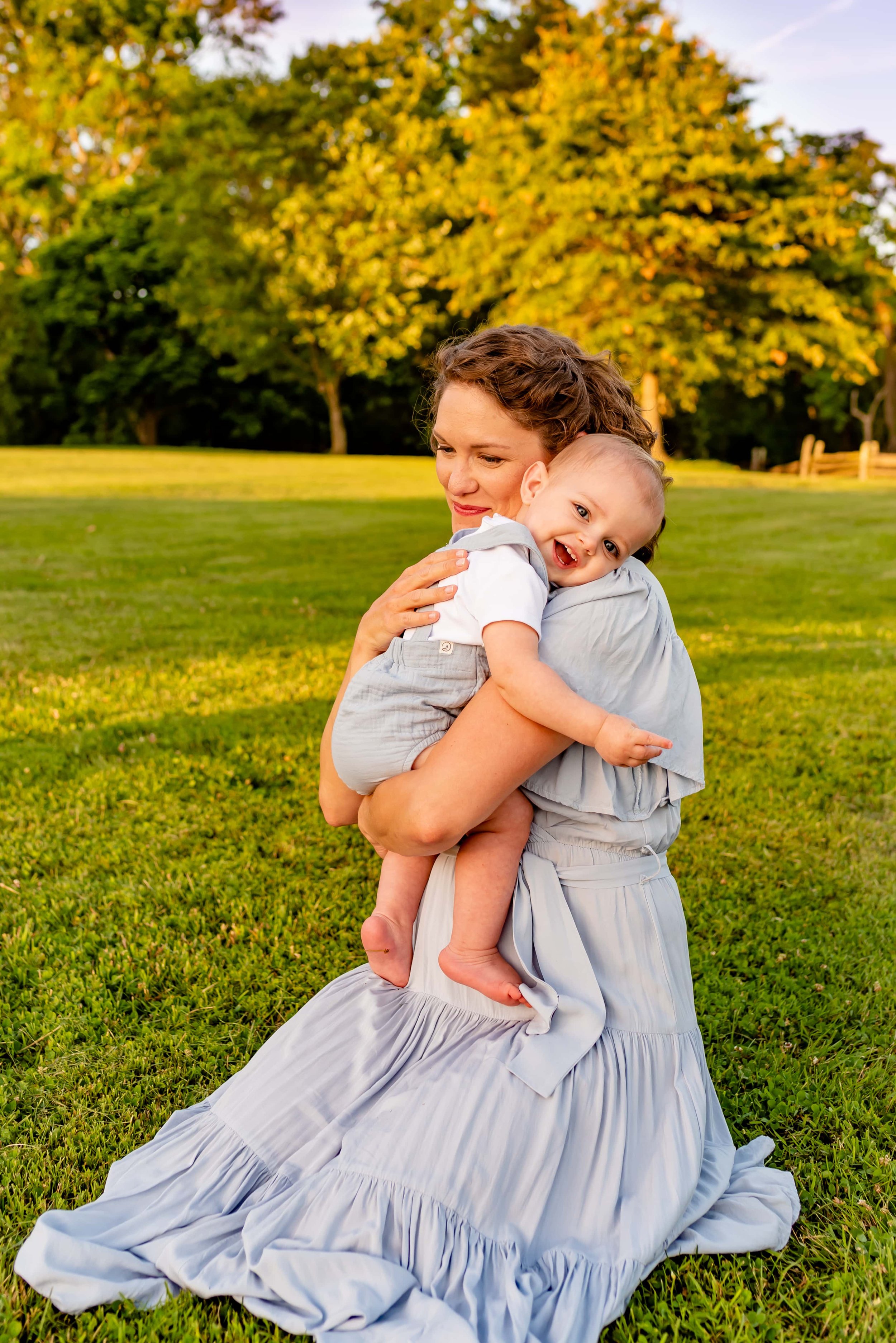 Maryland mom cuddling smiling baby