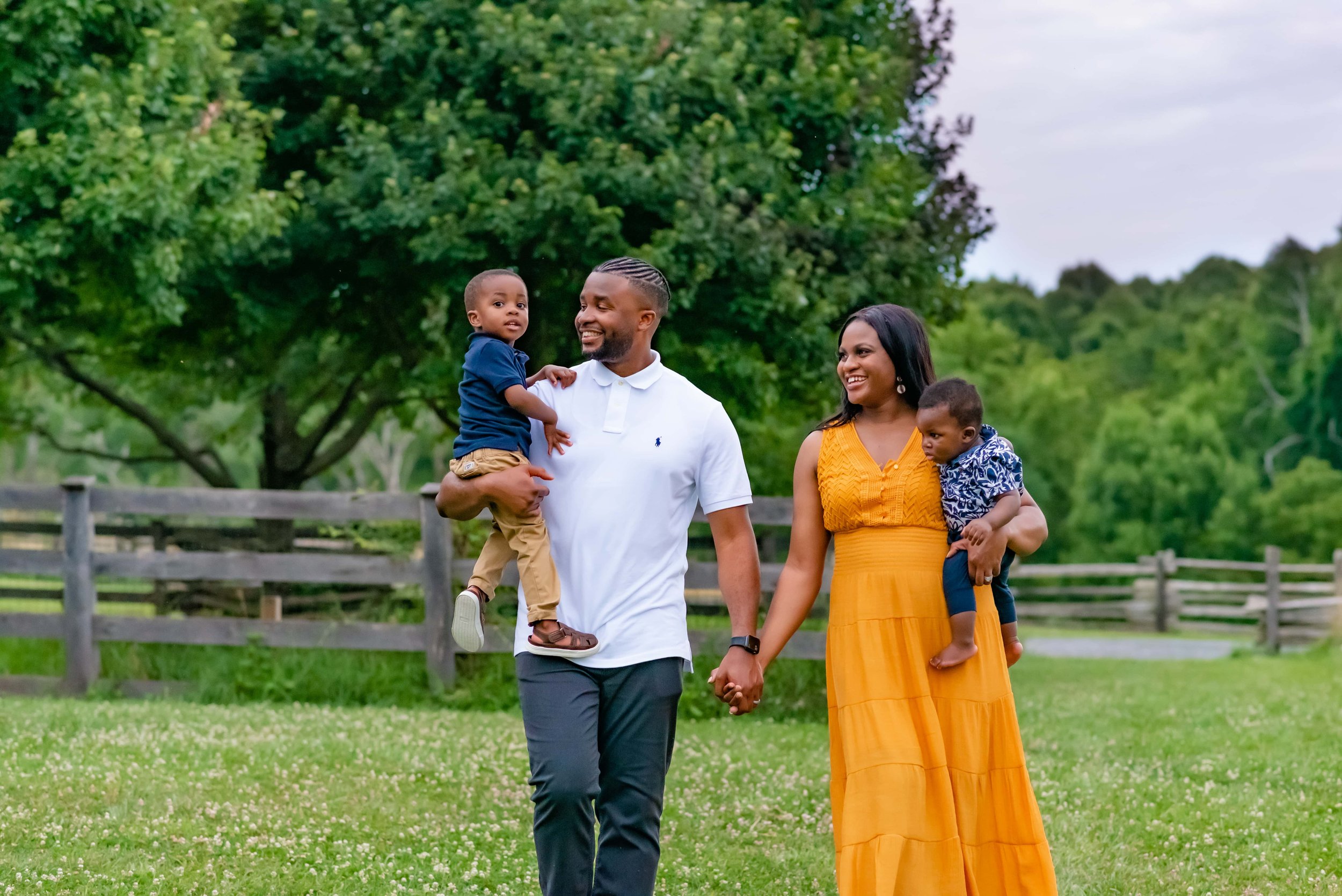 Maryland family photoshoot with family walking through field