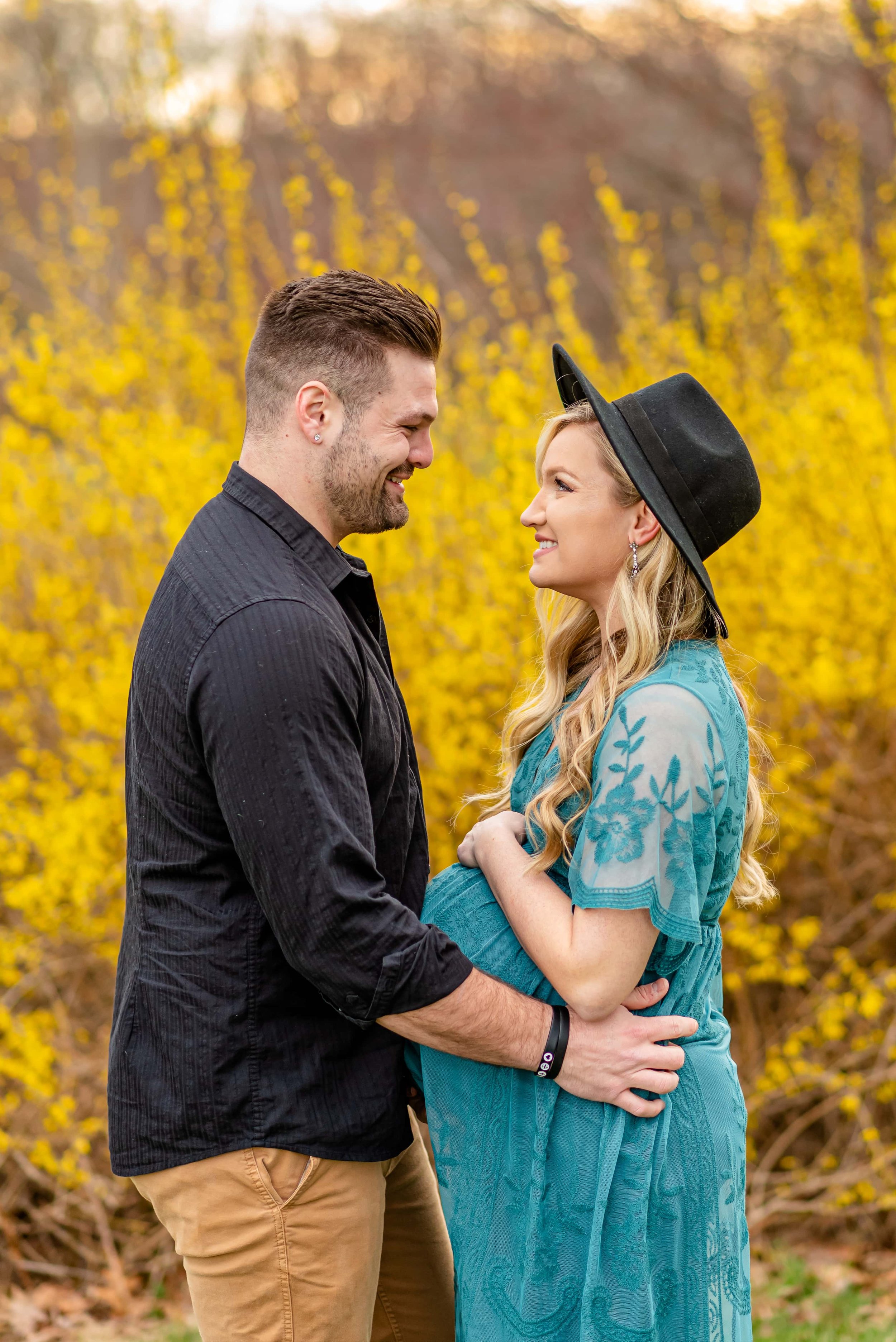 Maryland Maternity Photoshoot with expecting couple looking at each other