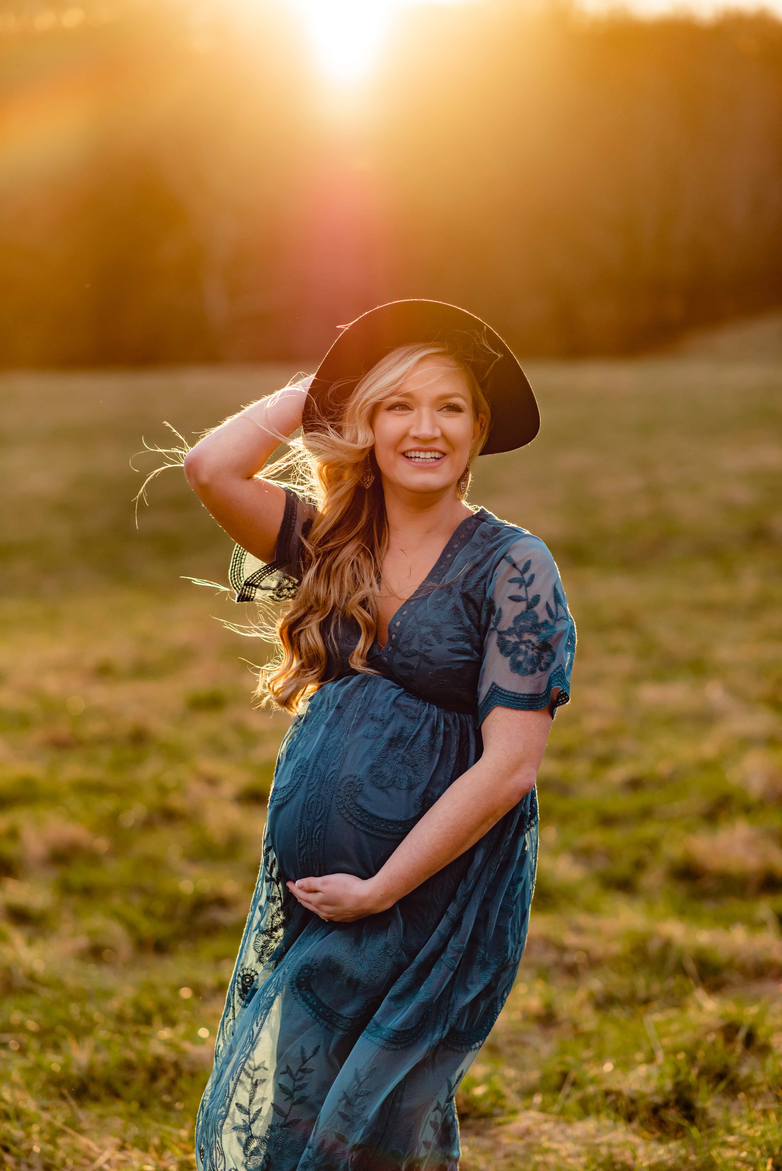Maryland Maternity Photoshoot with smiling expecting mom and glowing sun beams