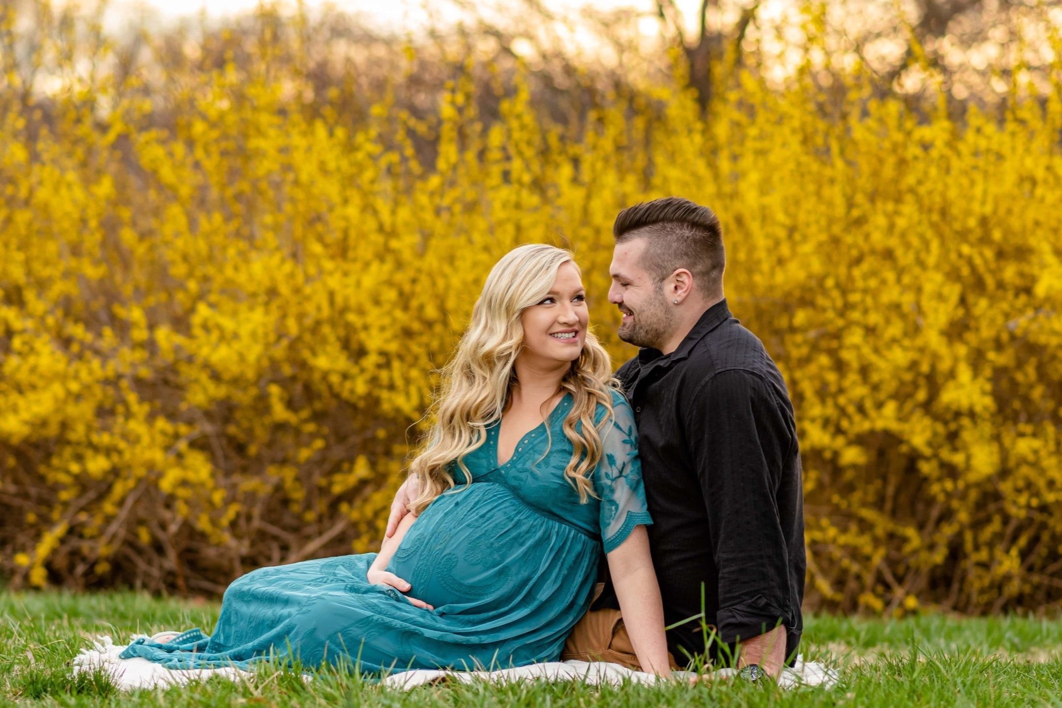 Maryland Maternity Photoshoot with expecting couple sitting on a blanket