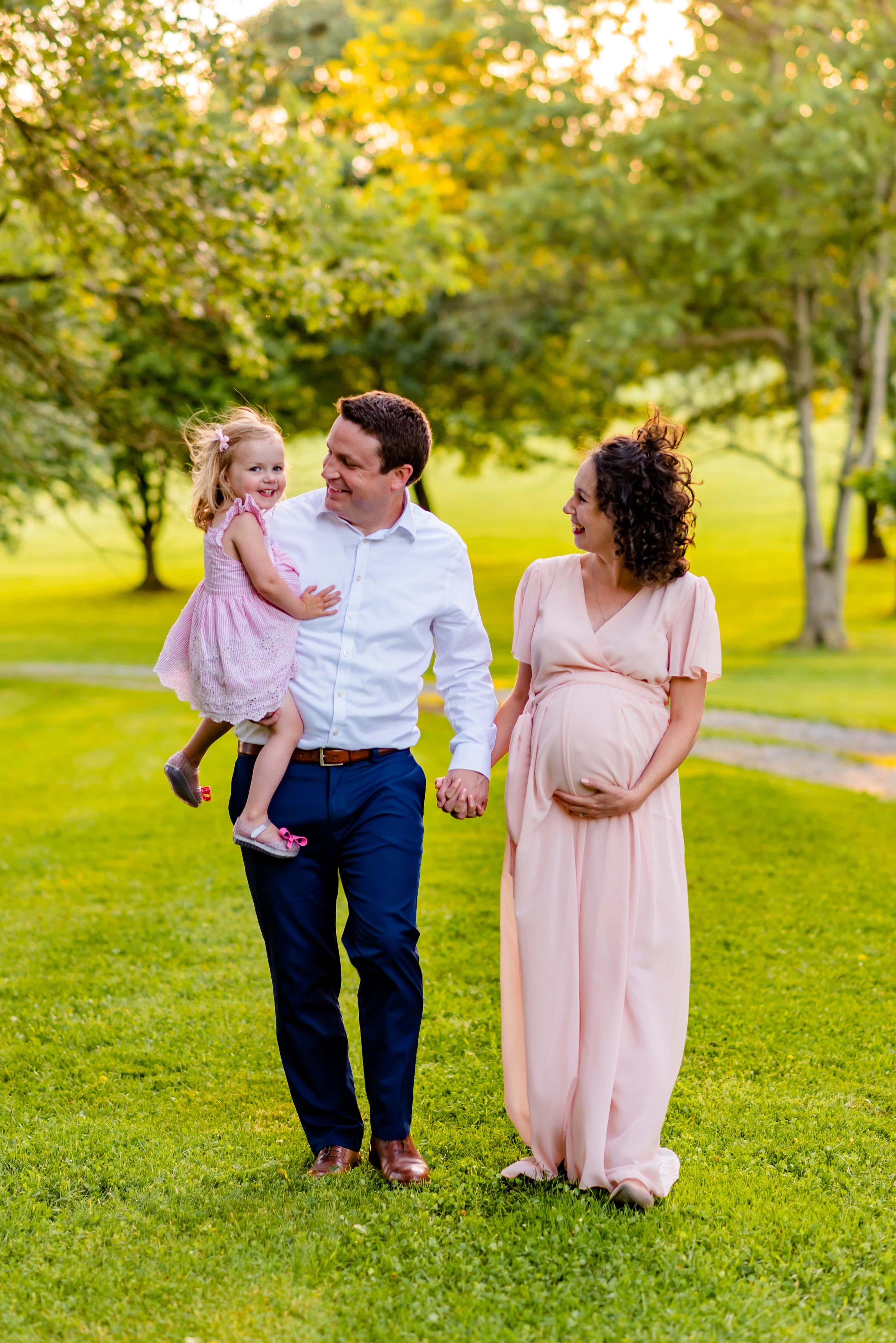 Maternity Photo of man, pregnant woman and small girl 