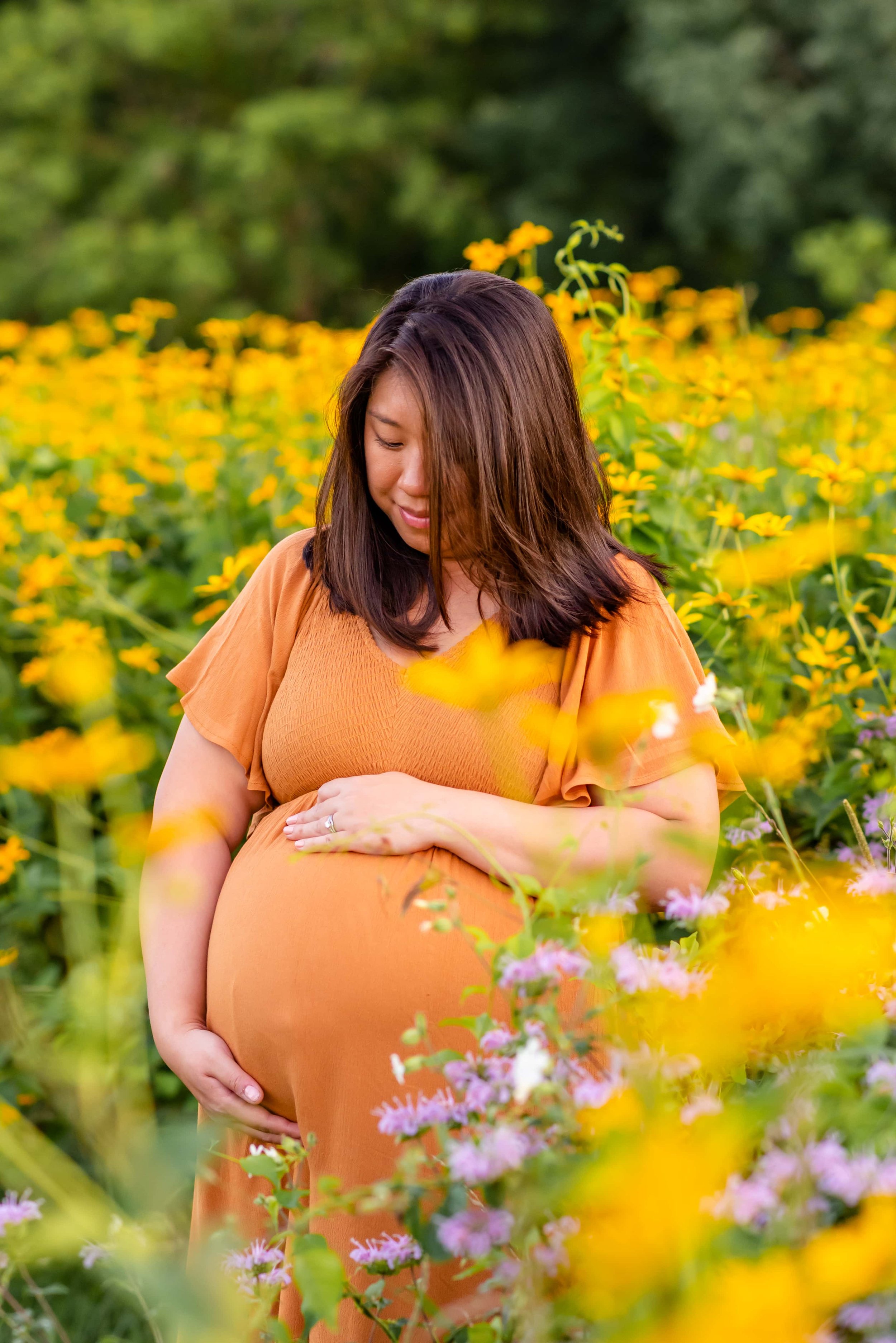 Maryland Maternity Photo of woman looking at belly