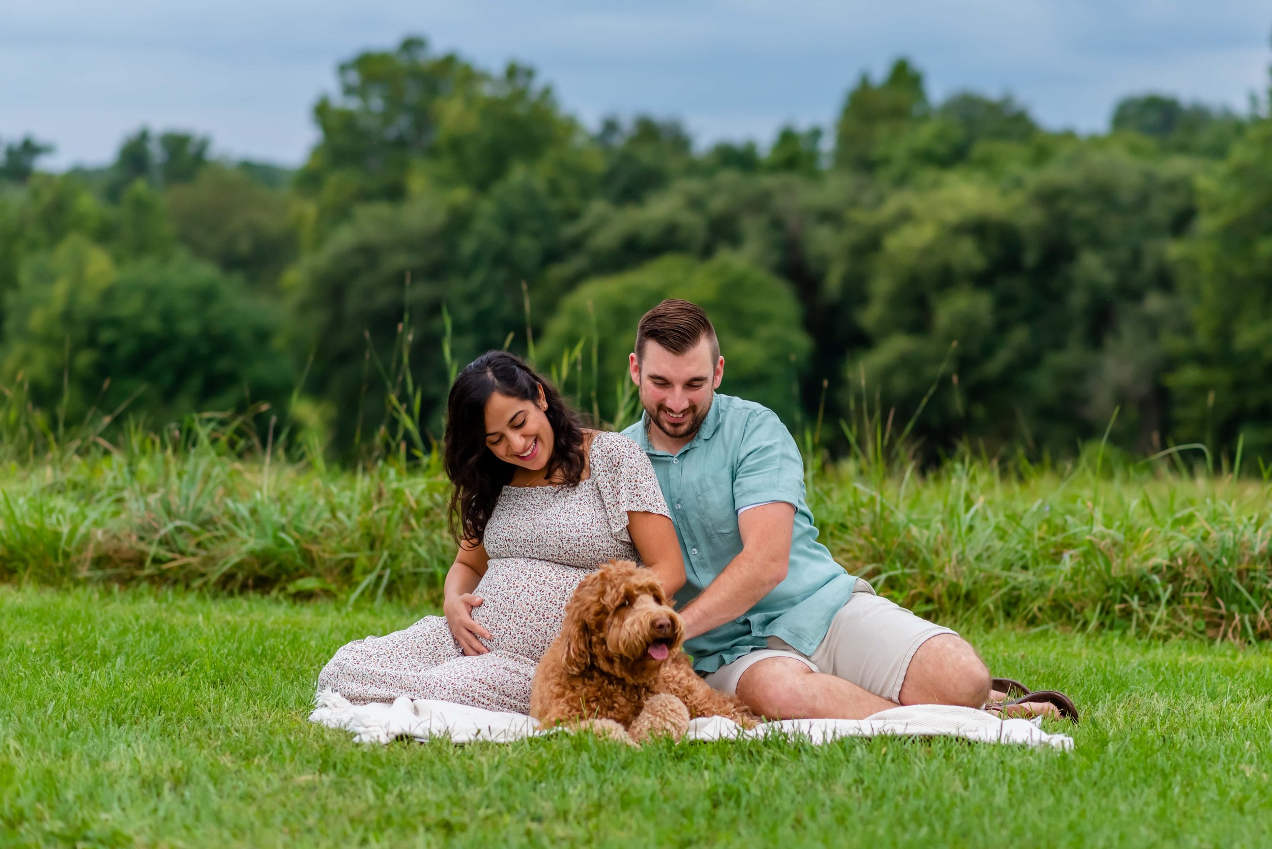 Maryland Maternity Couple playing with their dog