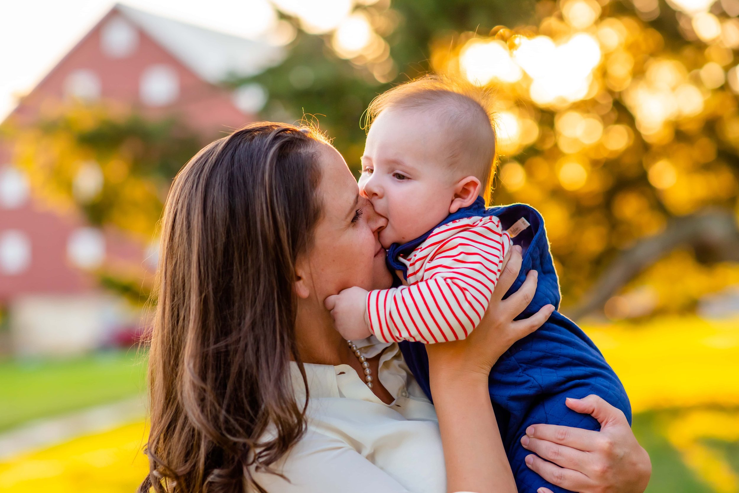 Summer family photo of mom and baby at sunset