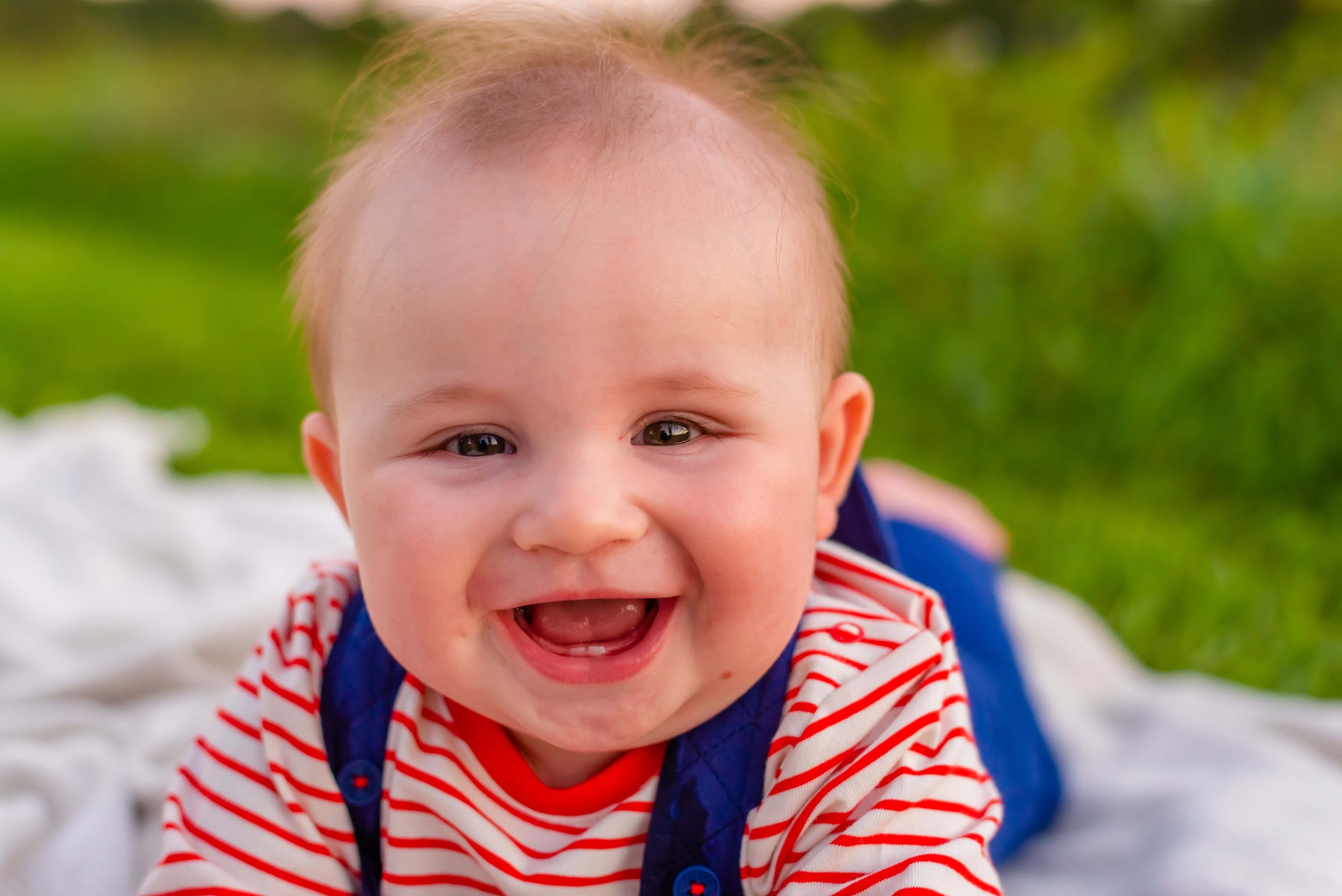 Close-up photo of baby smiling
