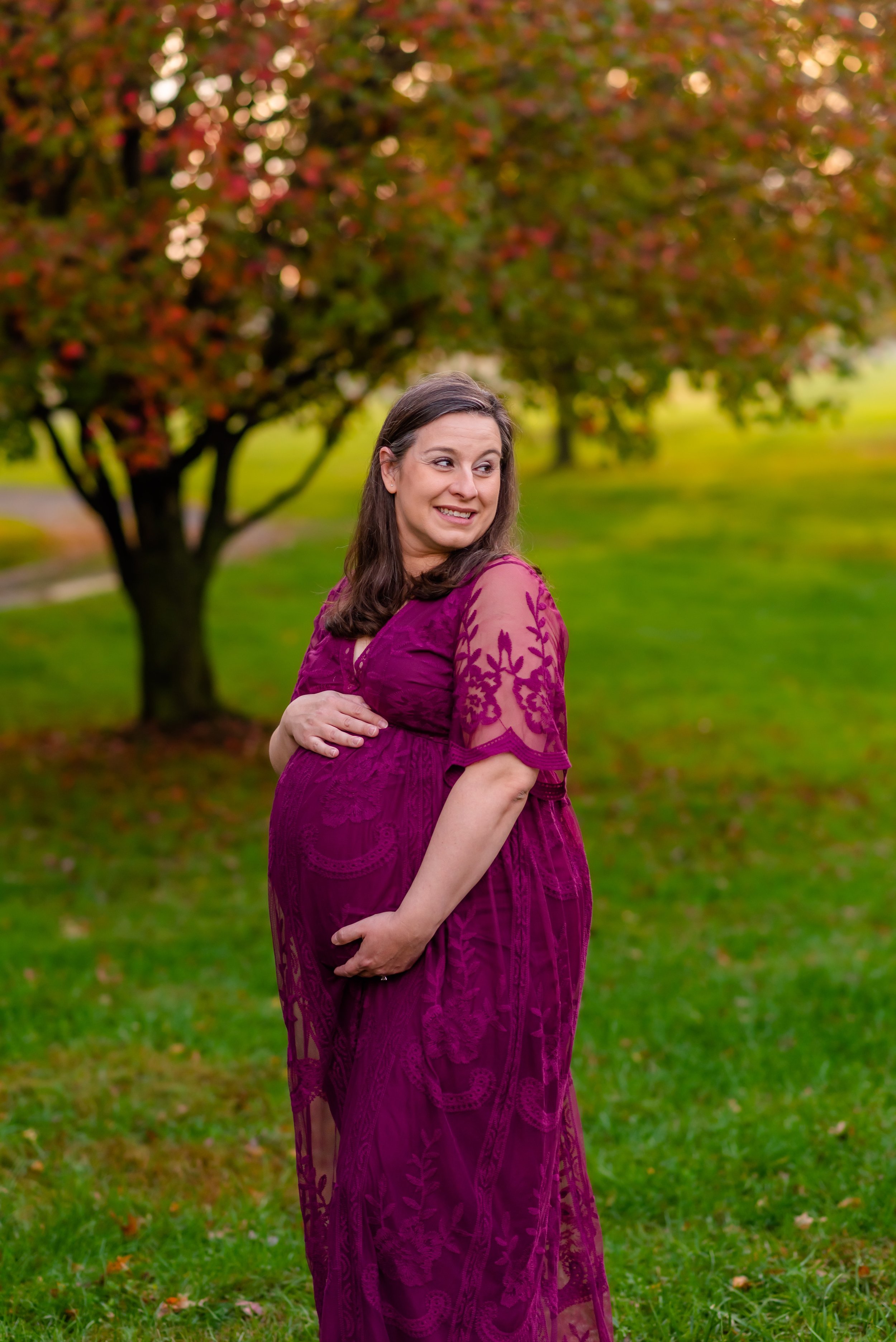 Maryland Maternity Photos - Pregnant woman looking over her shoulder and smiling