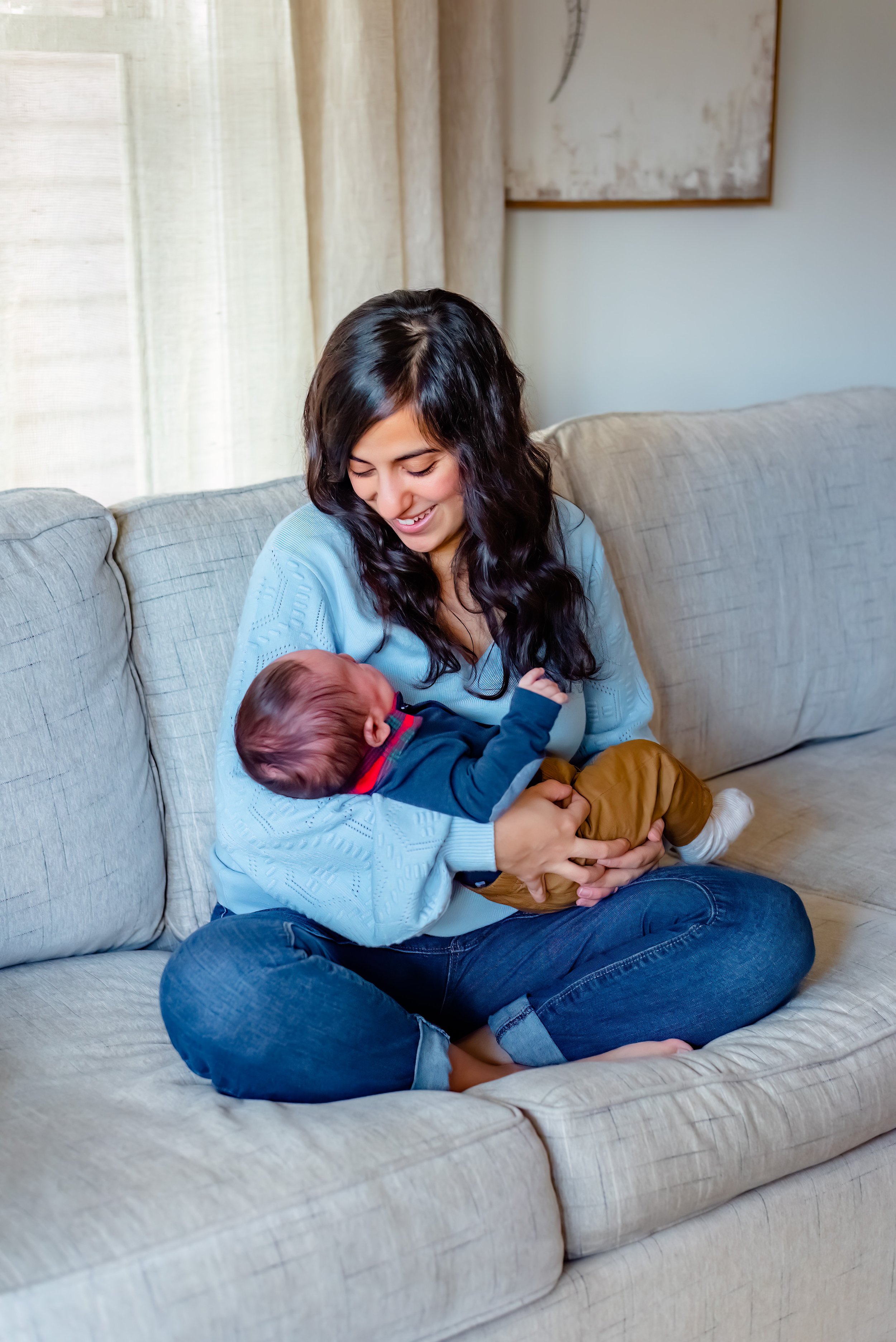 Newborn photograph with mom holding baby