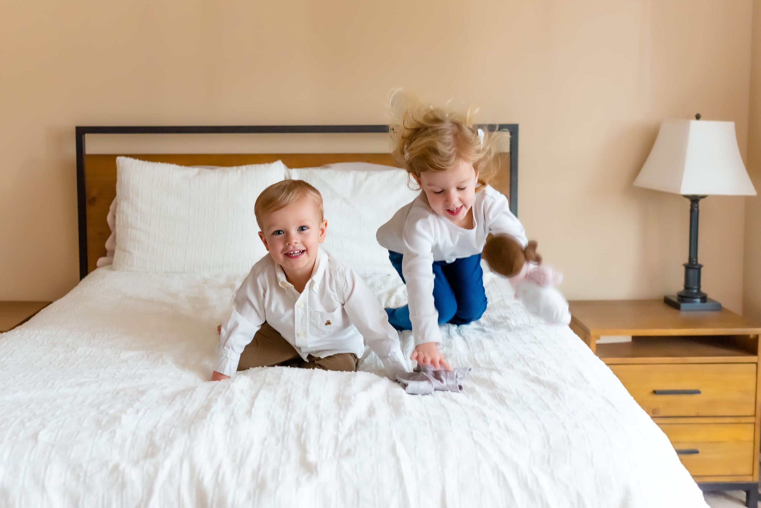 Maryland Lifestyle Newborn Photographer - young sister and brother playing at a newborn session 