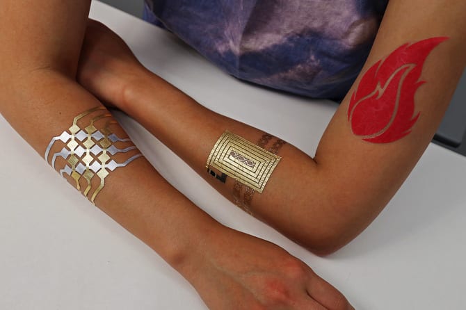  DuoSkin allows users to create three types of user interfaces: 1) input on skin through capacitive touch sensing,2) output on skin through thermochromic resistive heating circuitry, and 3) wireless communication through NFC. (Photo: Jimmy Day) 