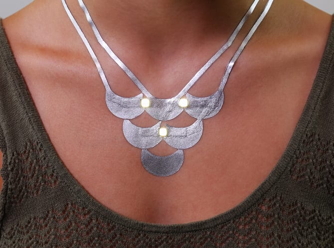 DuoSkin enhances the aesthetics of existing metallic jewelry-like tattoos by embedding LEDs in gold leaf traces. (Photo: Jimmy Day)