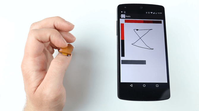  NailO works as a X-Y coordinate touchpad on your fingernails. (Image courtesy of MIT Media Lab) 