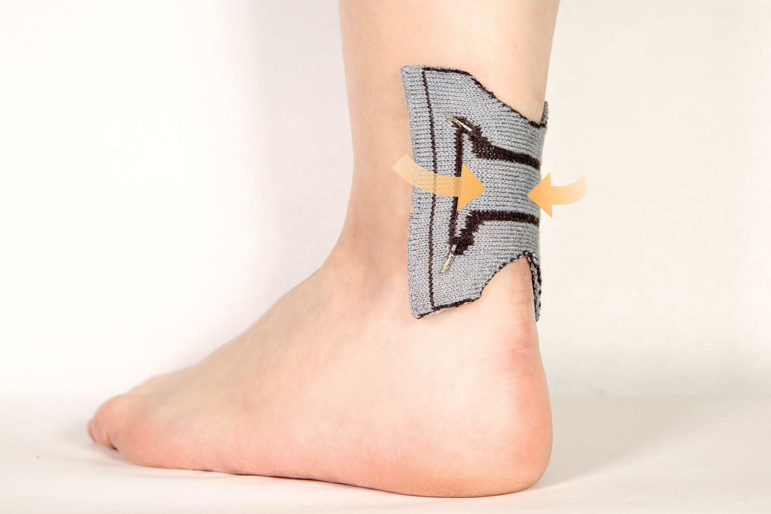  KnitDermis pinch interface during actuation while worn on the ankle. (Image Credit: Hybrid Body Lab) (License:&nbsp;CC BY-NC-SA 4.0) 