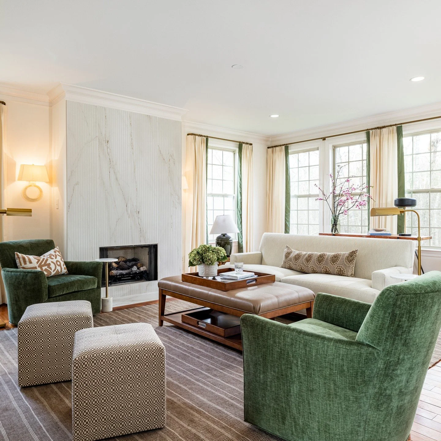 What a lovely family to work with on this main floor refresh. The clients wanted comfort, a place to kick up their feet and relax without too much fuss. I chose lush fabrics, custom upholstery, and a @cosentinousa sleek large-scale reeded tile for th