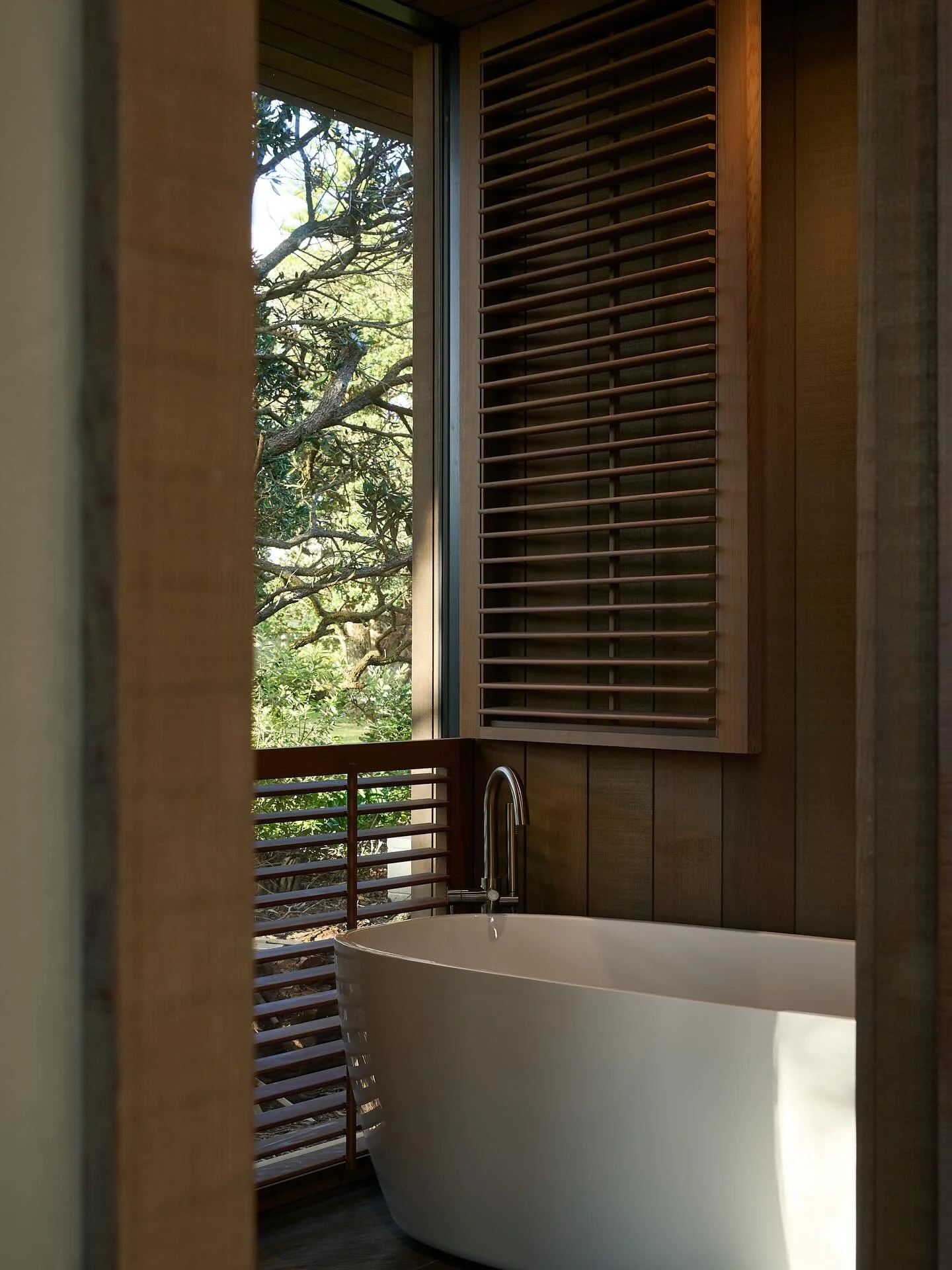 Across the bathroom, master ensuite and powder room of the Pohutukawa Beach House, we&rsquo;ve used a range of fixtures and fittings from @robertsonbathware from tapware to the bath and basins. We love how effortlessly their pieces work in any space,