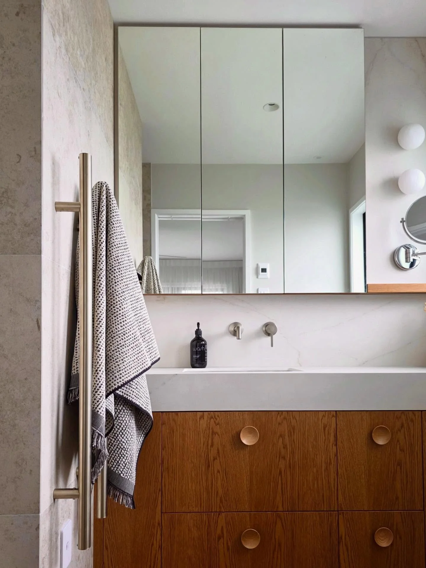 Another peek at our recently completed Half Moon Bay bathroom! This interior uses the @heirloom_int Aura brushed nickel heated towel poles - a sleek vertical option that keeps the space looking clean while making it super easy to drape and warm your 