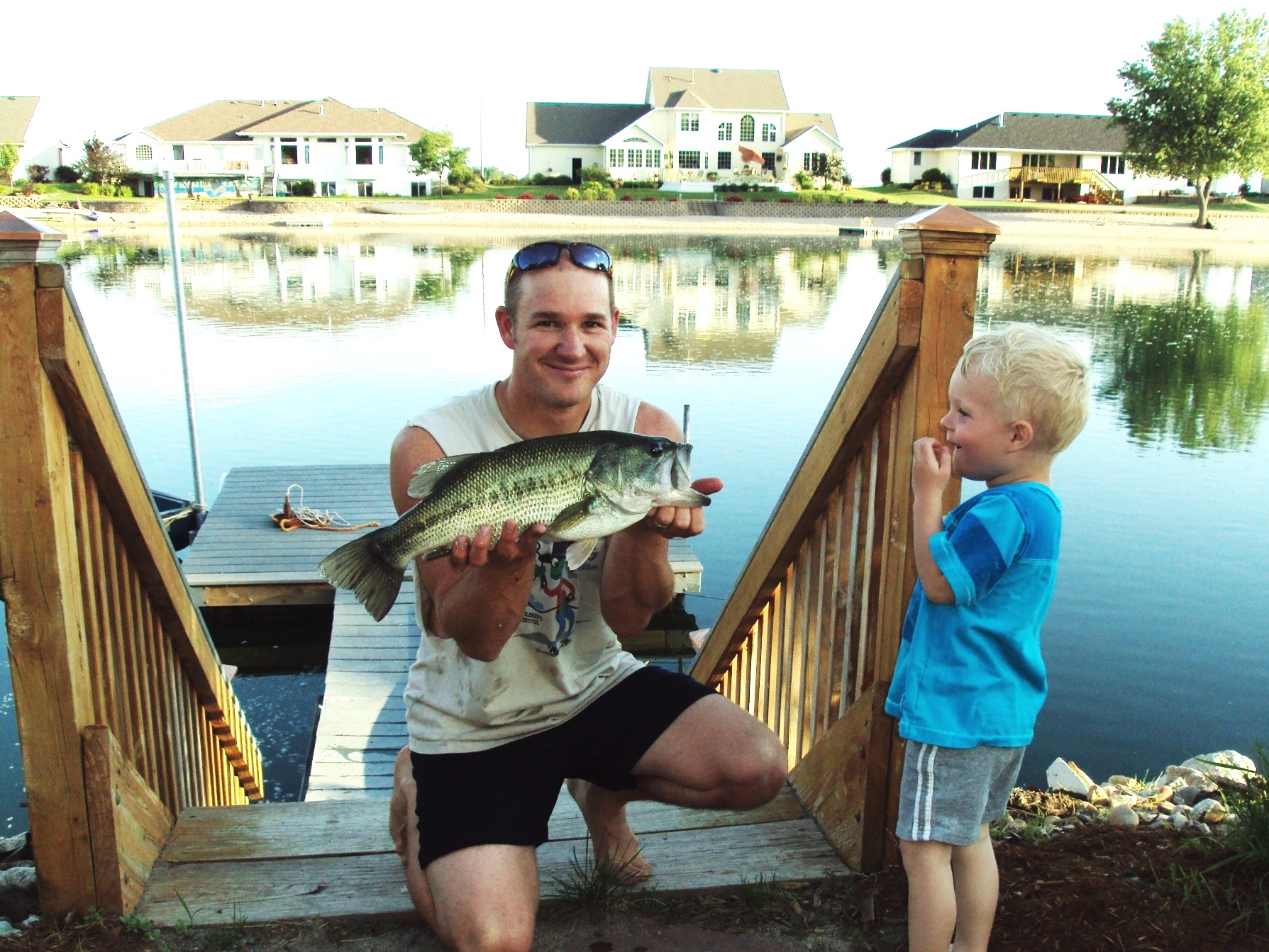 Clay and I with a nice Bass off our dock in Grand Island