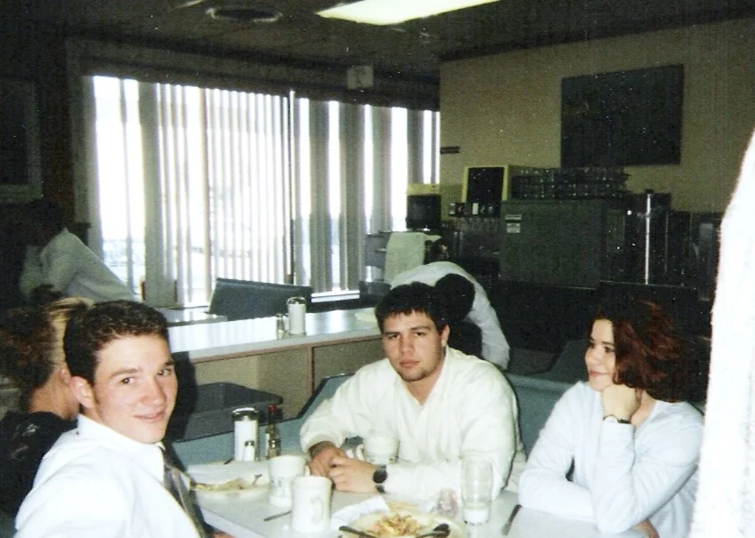 My cousins Seth and Erin crammed into a booth with Sadie and I. Family fish fry 1997.