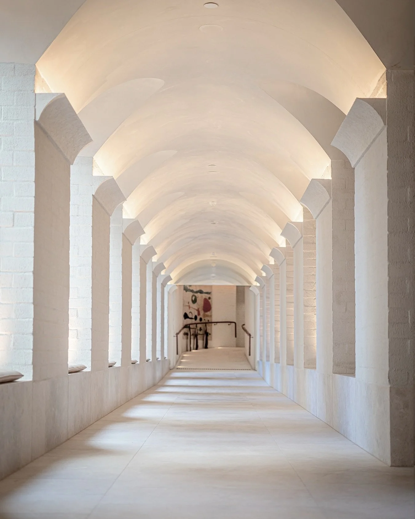 White arches and measured light @theevehotel 
~ Repetition creating calm through rhythm 
~ Soft lighting tracing the curve of the space 
~ Stillness stretching through architecture 

Shot by @el_glanic