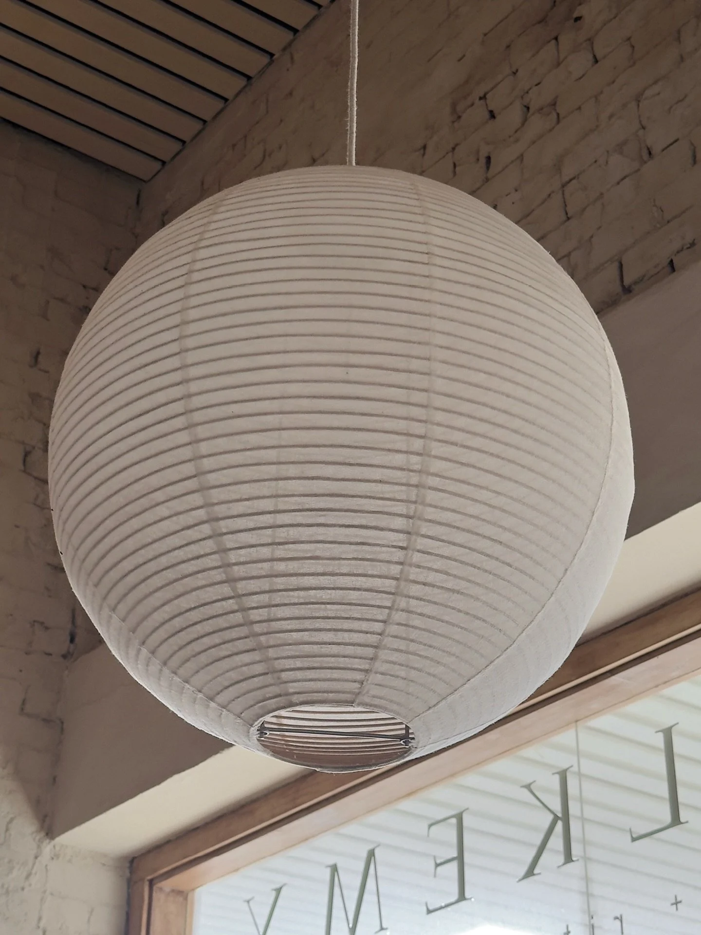 Light held in its simplest form @lovealkemy 

~ Soft diffusion through paper texture
~ Subtle shadow fall-off across the ceiling
~ Neutral palette keeping the frame calm and balanced

Photographing this was about restraint, letting a single source of