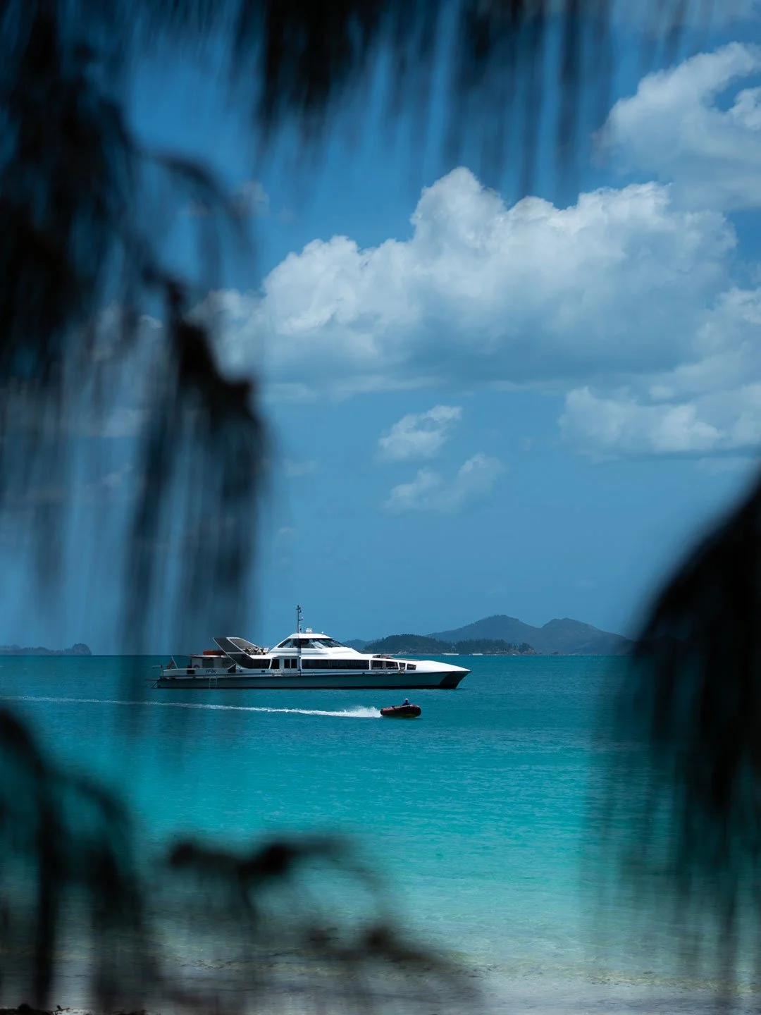 Luxury yacht floating on turquoise waters in Airlie Beach