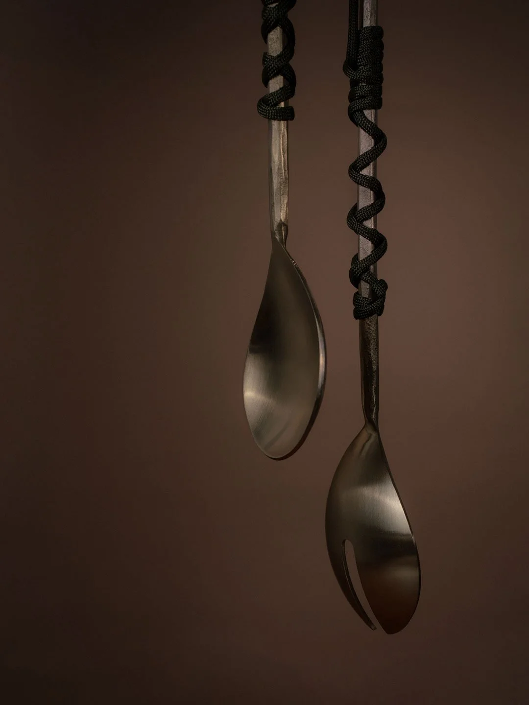 Spoon photography suspended by ropes
