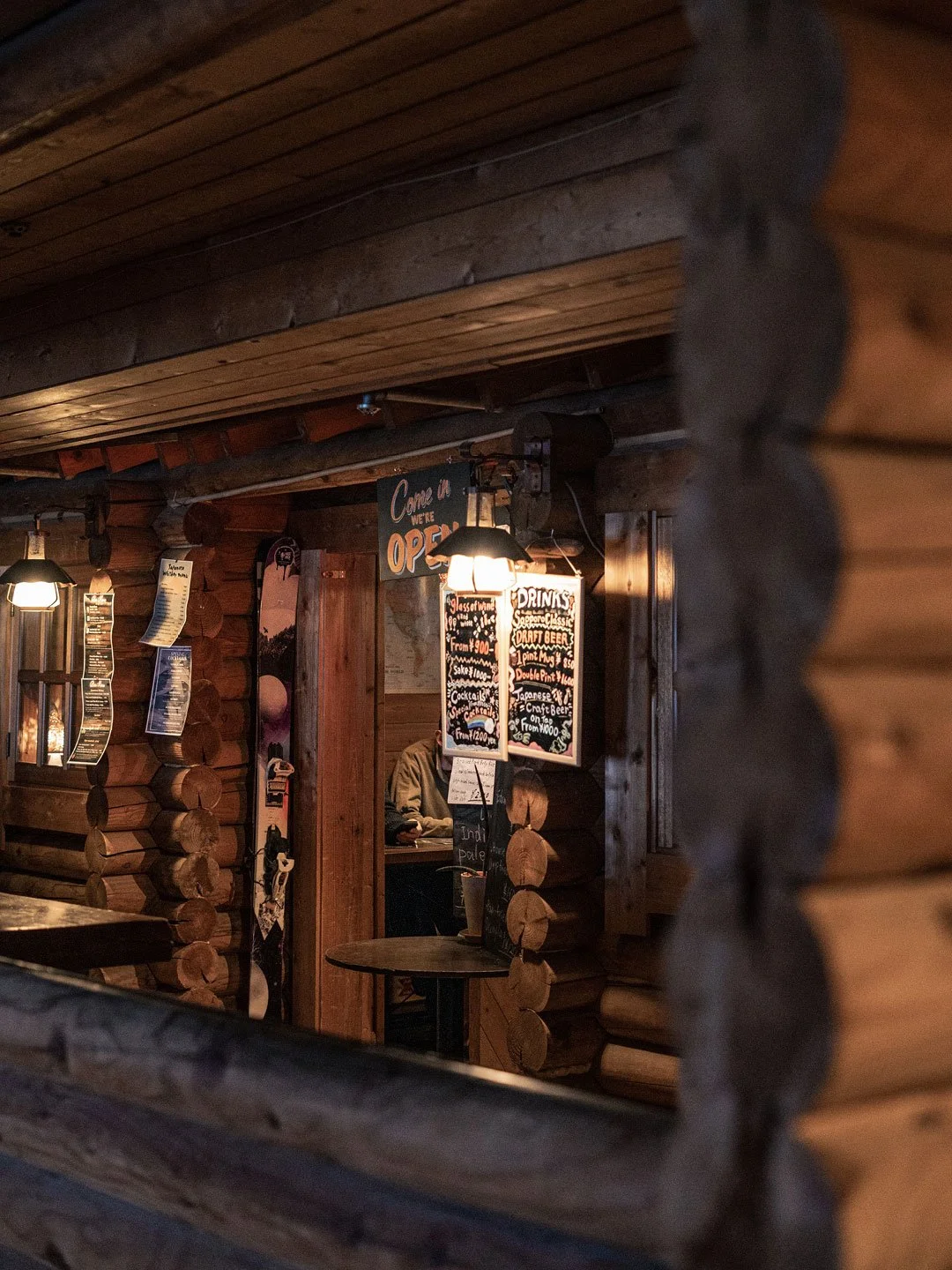 Warm wooden lodge exterior in snowy Niseko, Japan