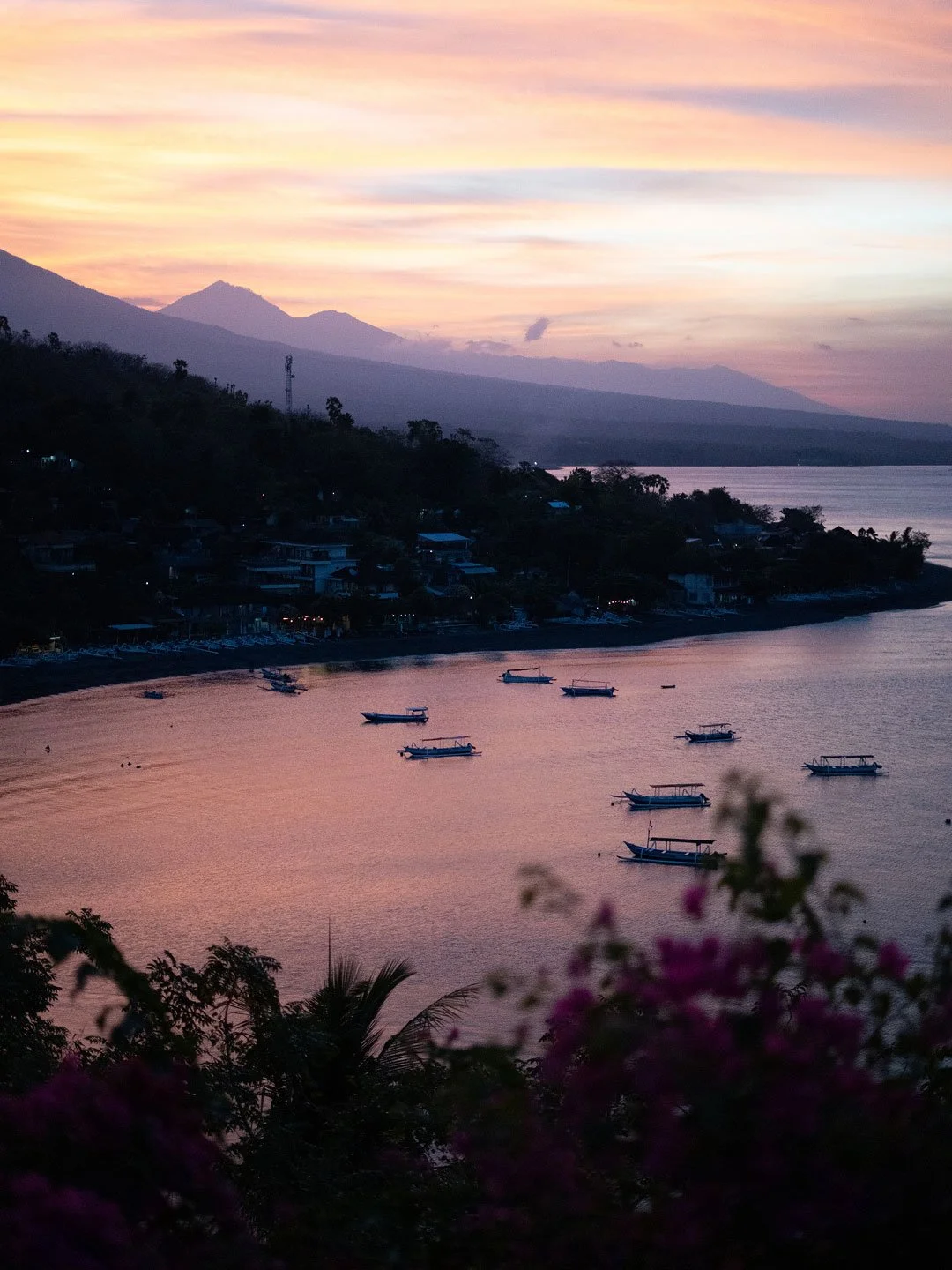 Panoramic coastal sunset with fishing boats in Bali