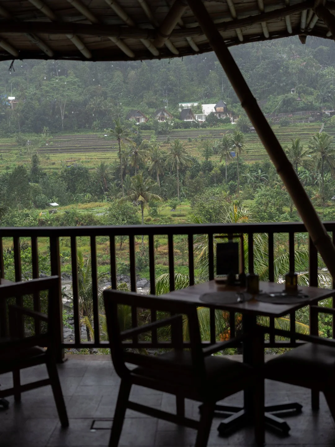 Open-air dining area with tropical rainforest views in Bali