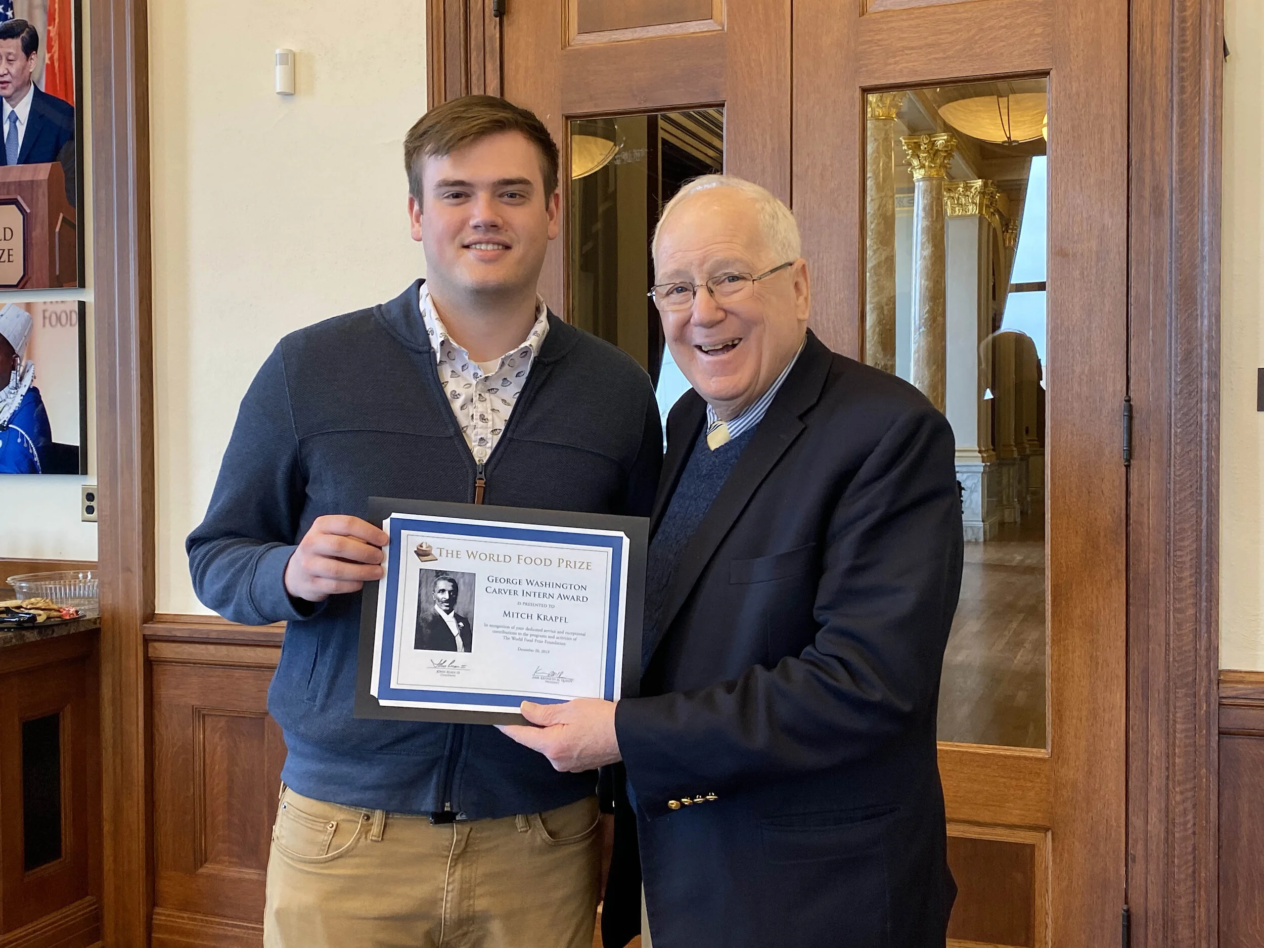 Ret. Ambassador Kenneth Quinn presenting me with The World Food Prize George Washington Carver Intern Award.