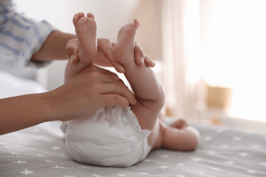 Newborn baby in disposable nappy