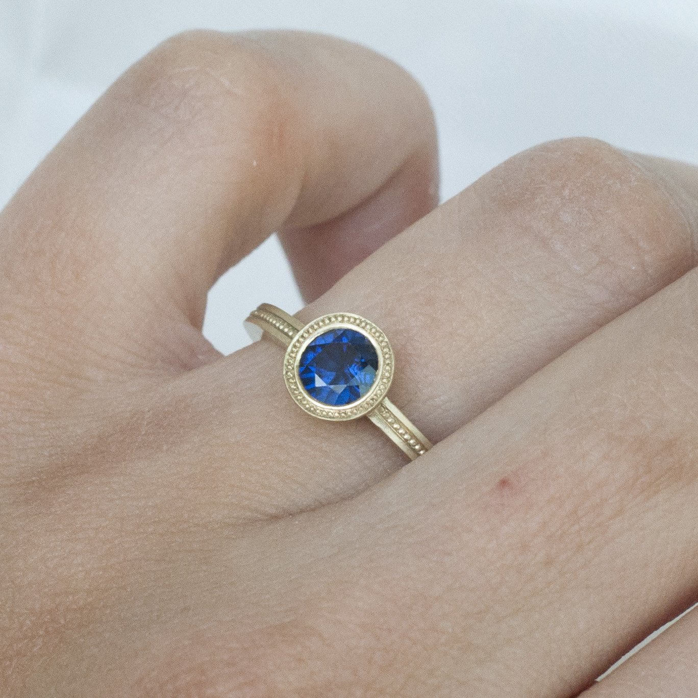 18K GG Blue sapphire round millegrain 1.jpg