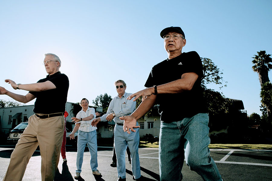 elderly groupl exercising outdoors.jpg