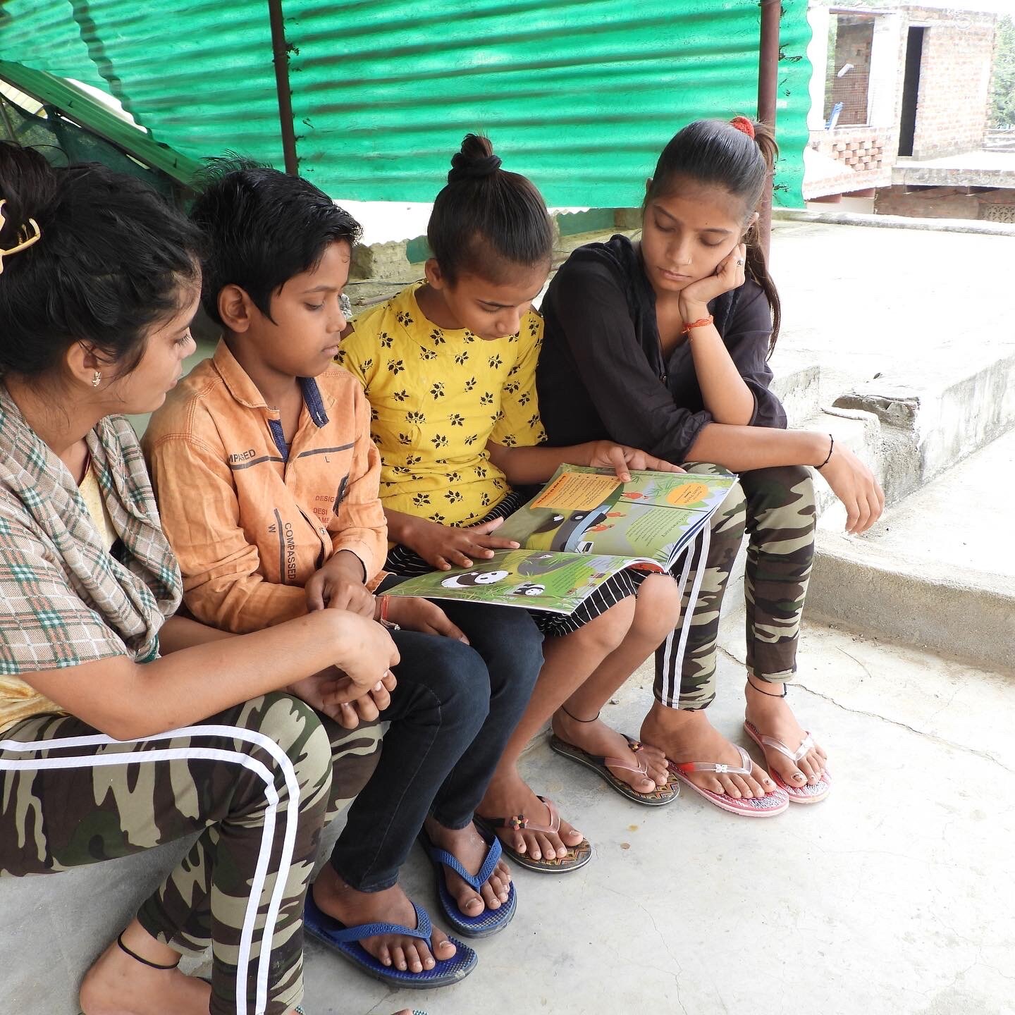 Children reading Red Alert! in India