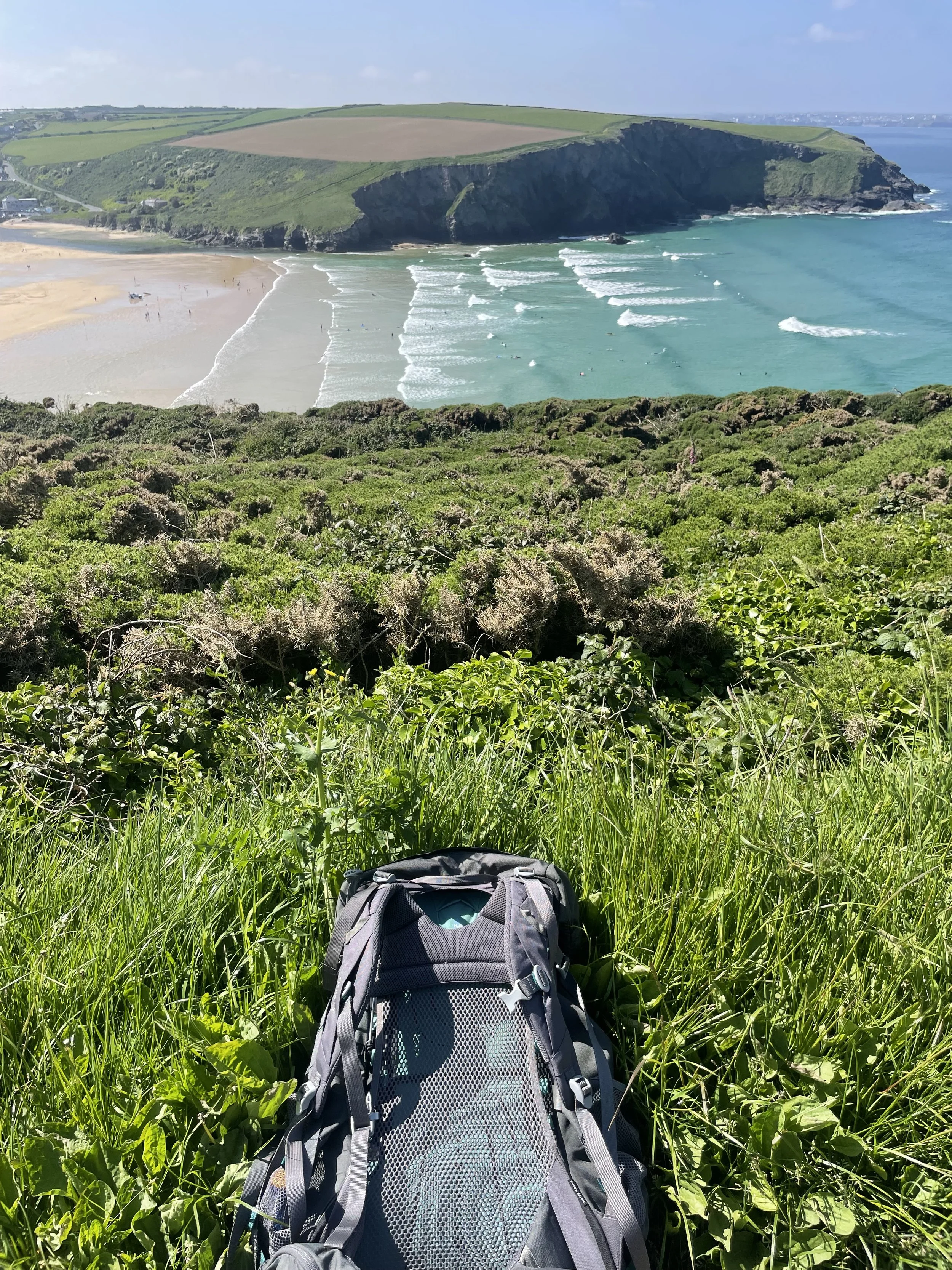 View of the South West Coast path with Catherine Barr's rucksack
