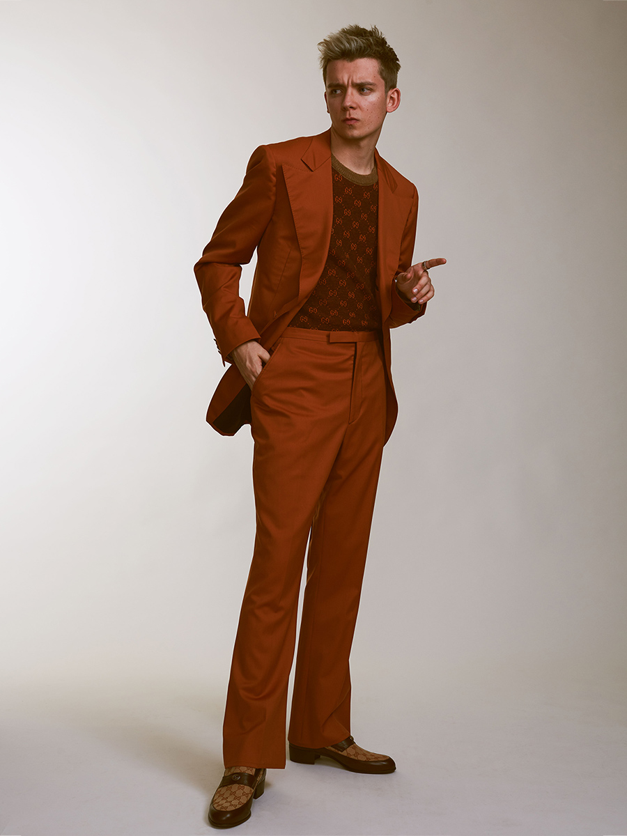 Suit: David Hart, Sweater: Gucci, Shoes: Gucci, and Glasses: Asa’s own