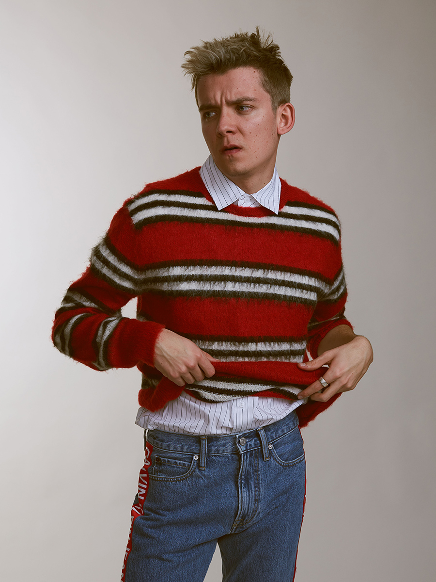 Sweater: Todd Snyder, Shirt: Saturdays NYC, Pant: Calvin Klein Jeans, and Shoes: Maison Kitsune