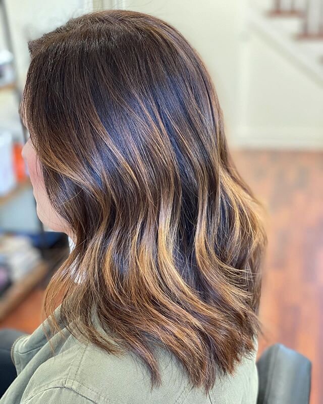 This balayage was through beautiful, dark, PERMANENT hair color! We were going for at least 2 levels of lift for today&rsquo;s appointment with hand painted clay lightener and we got it!