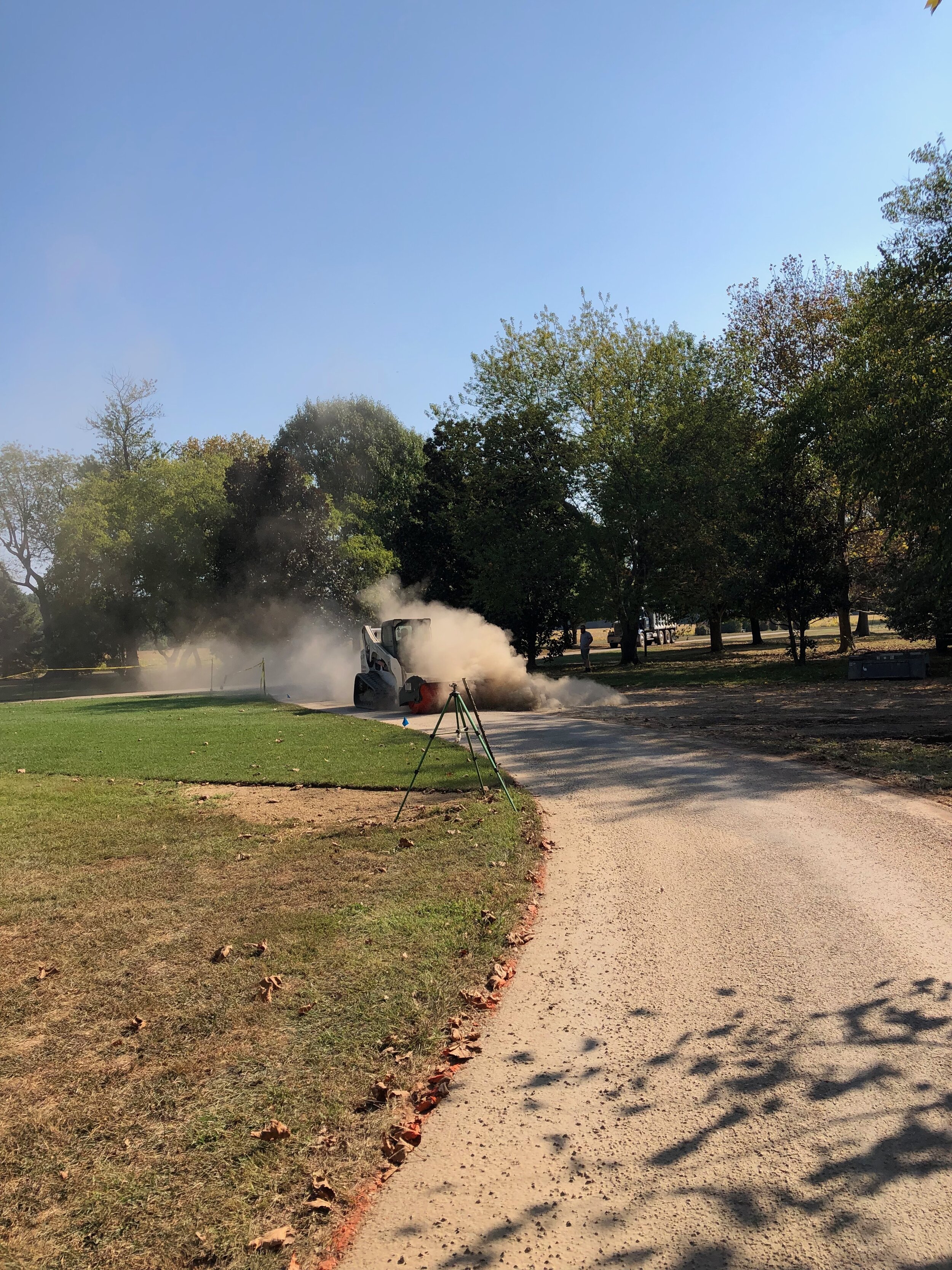 Kicking the dust up in preparation for new driveway.
