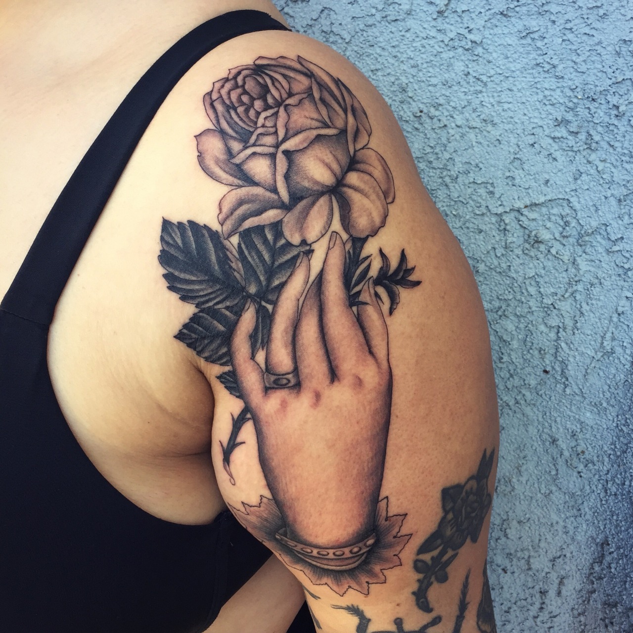 Micky Manning Hand with rose tattoo.jpg