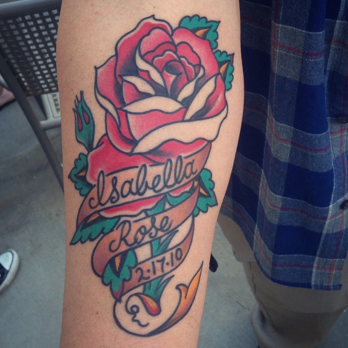 Micky Manning Traditional Rose with names tattoo.jpg