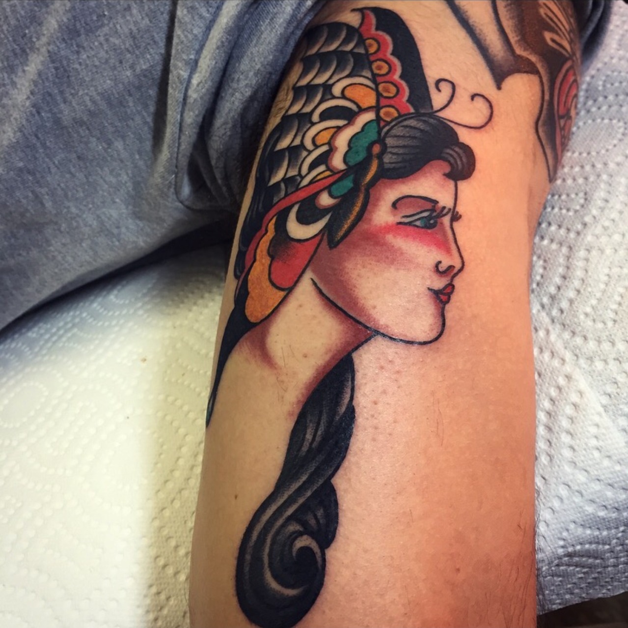 Micky Manning Girl head tattoo.jpg