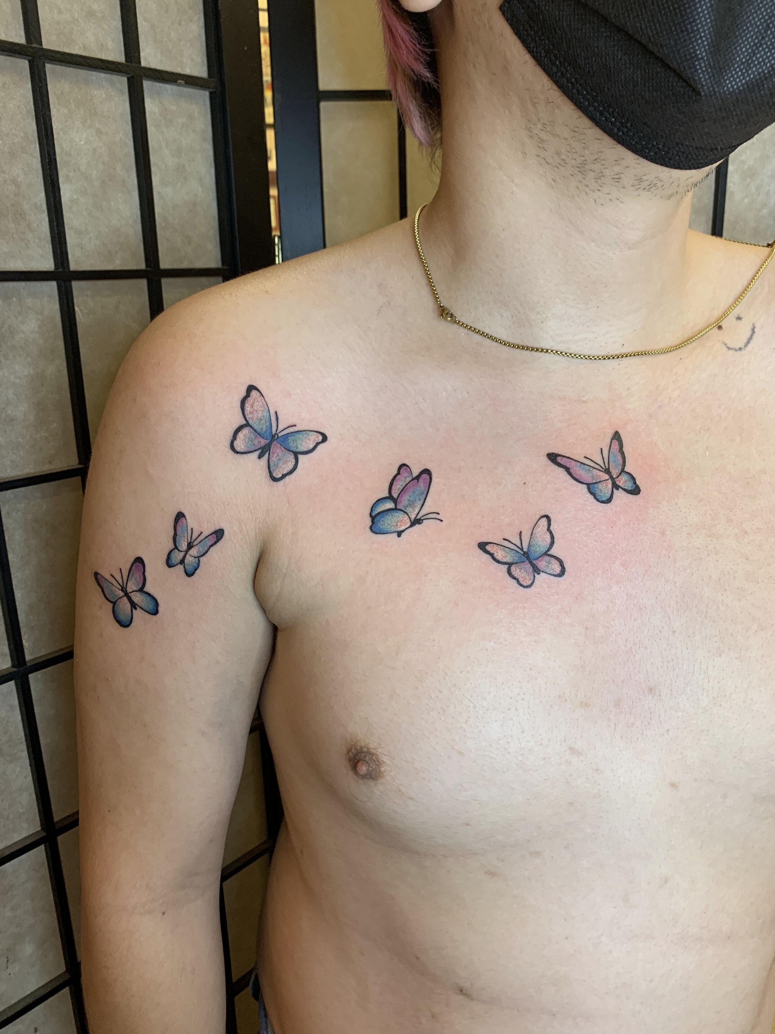 A woman with a butterfly tattoo on her chest photo  Free Fashion Image on  Unsplash