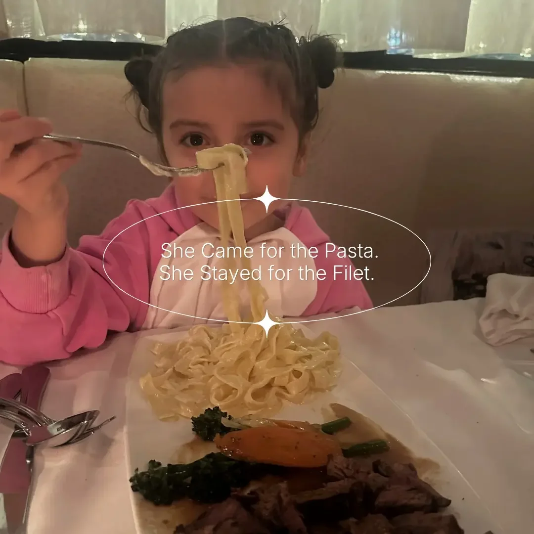 A young girl enjoying house-made pasta and filet mignon during a family Easter dinner at Giovanni's Restaurant in Ottawa.
