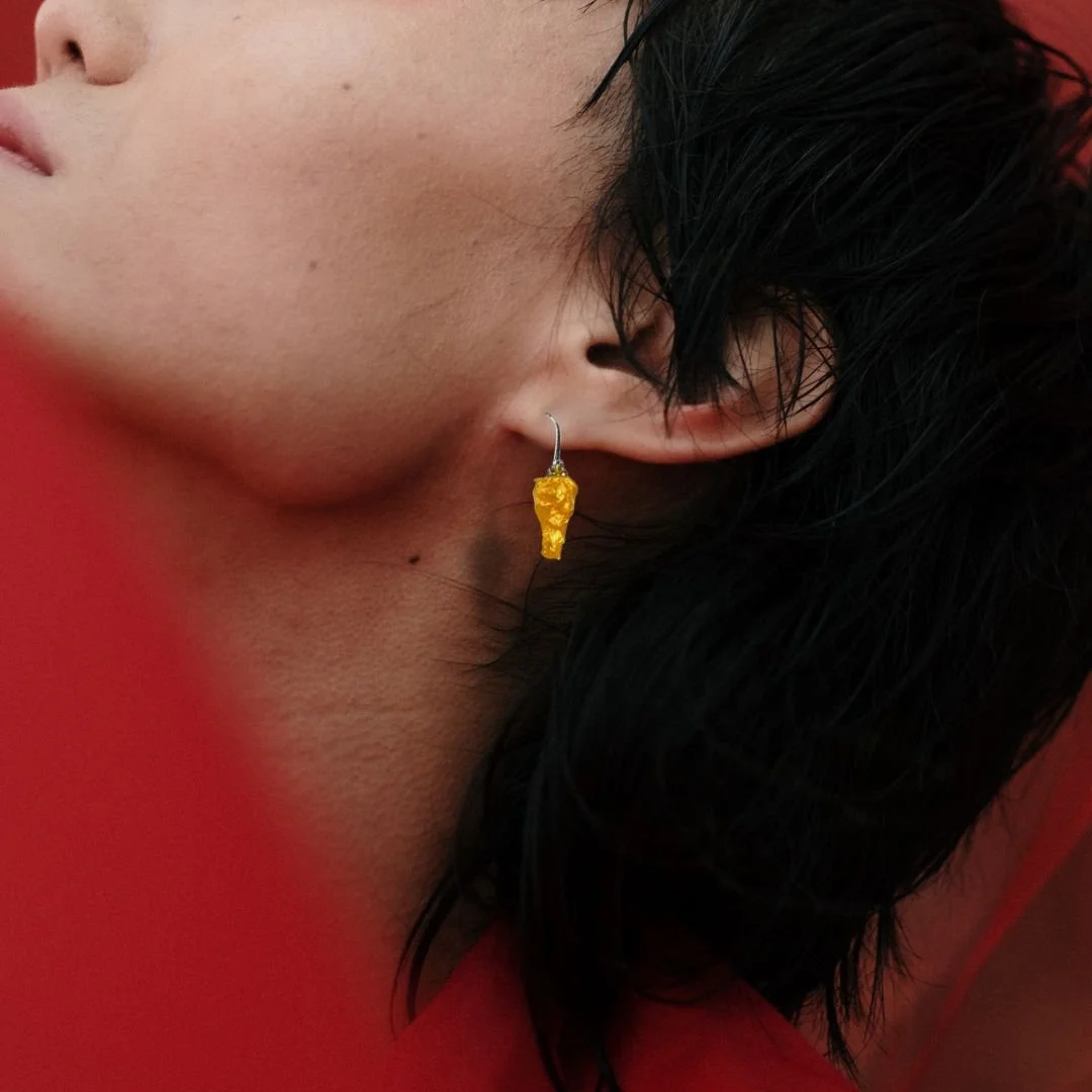 chicken leg earrings on asian model.jpg