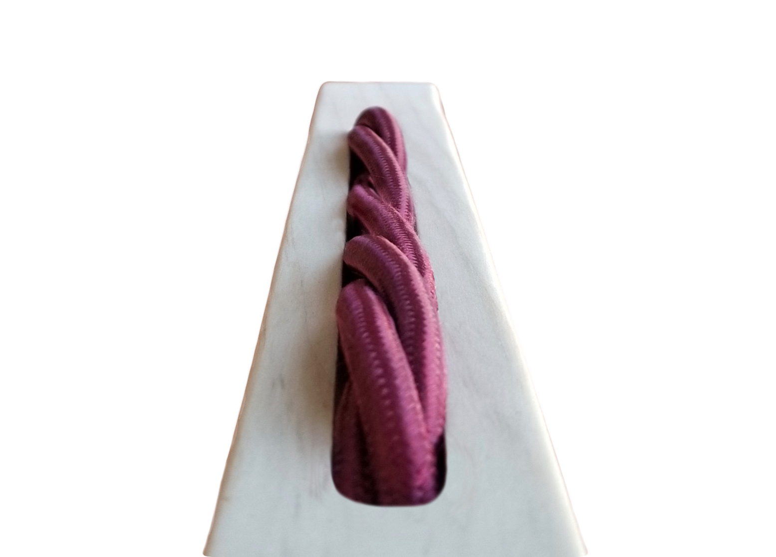  To link the cold shells to the natural wooden frame, a custom maroon weaved electrical cord is inlaid on the top support 