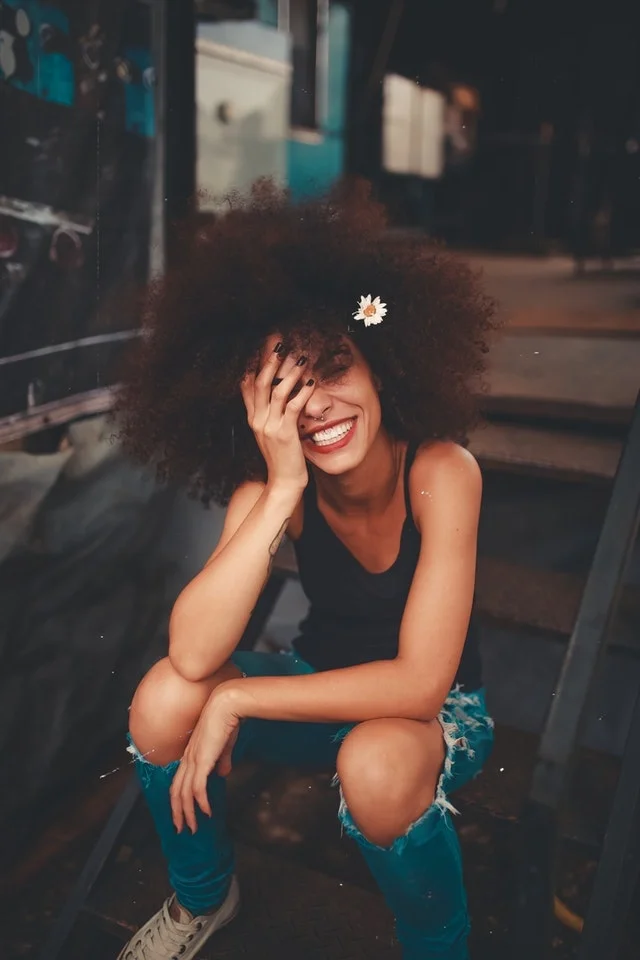WELLIVER-teen-smiling-flower-in-hair-min.jpg